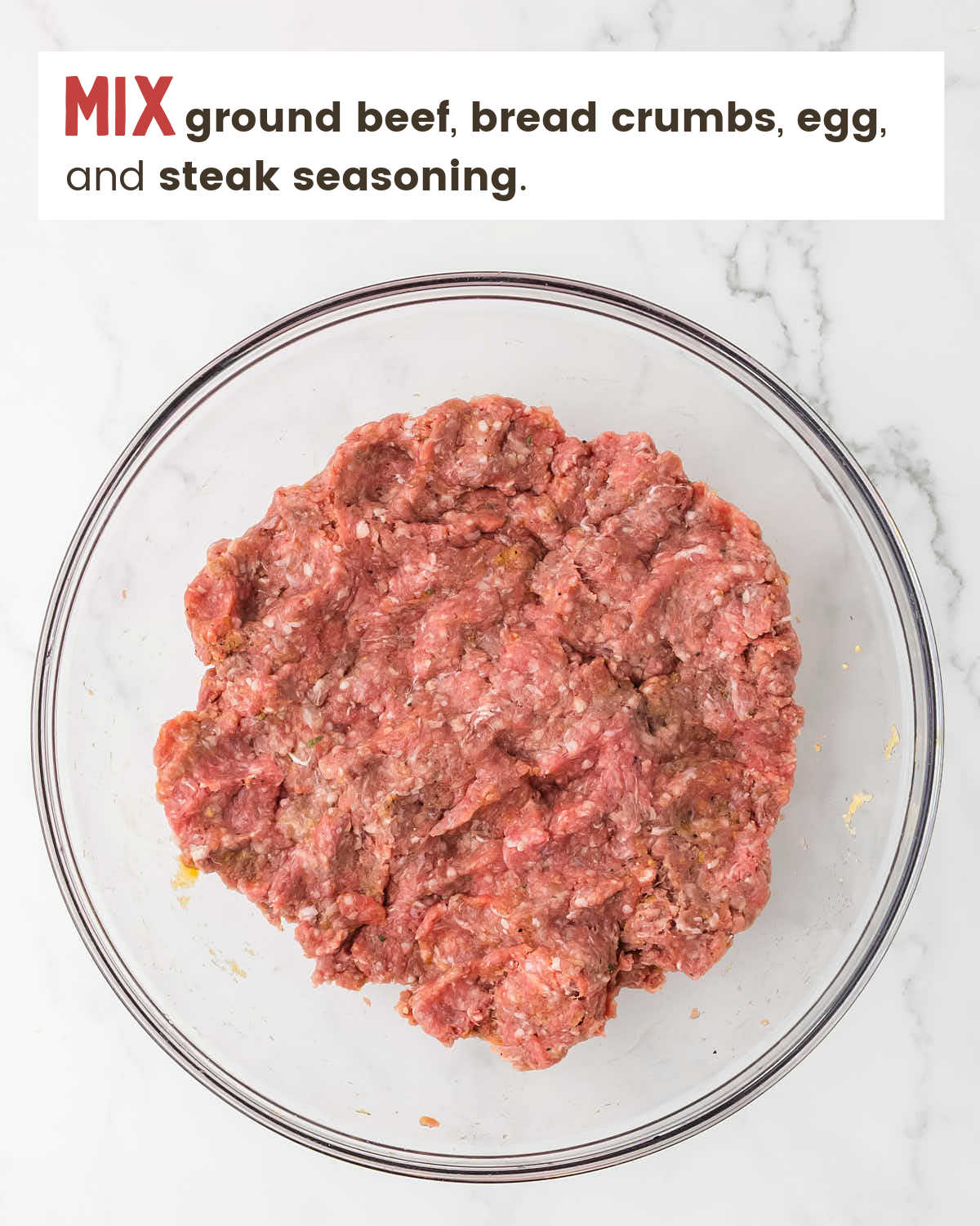 Ground beef mixture in a large glass bowl.
