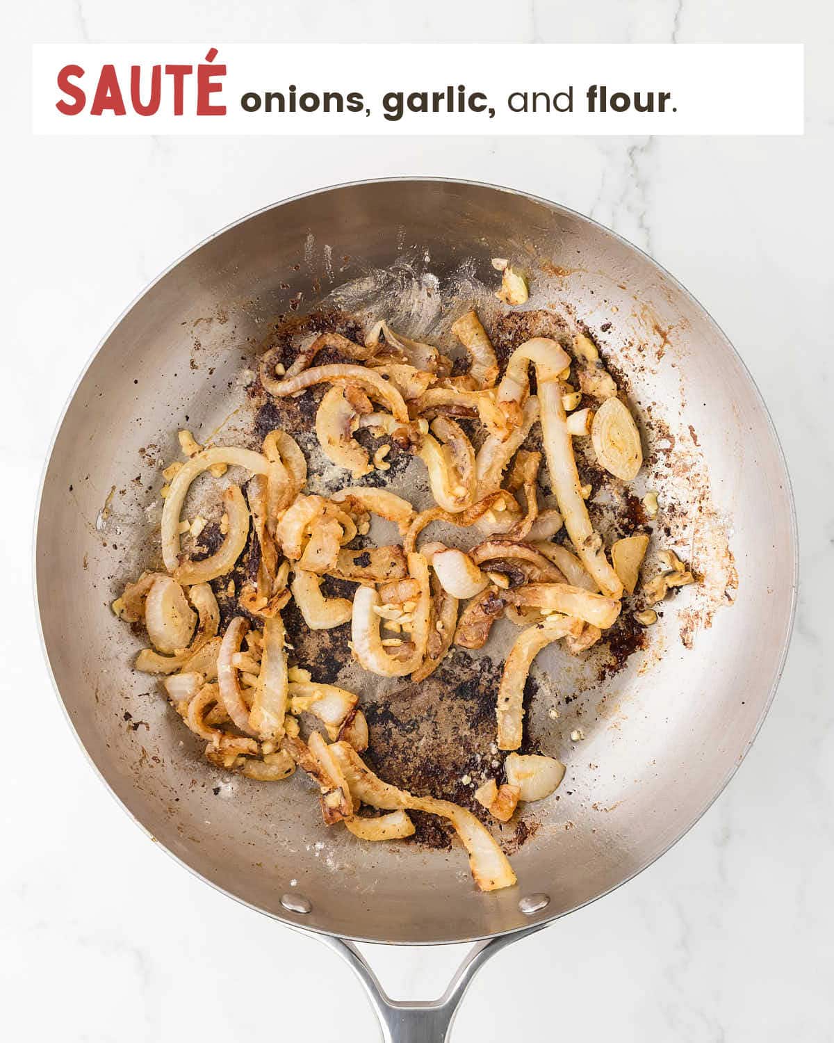 Sliced onions in a skillet.