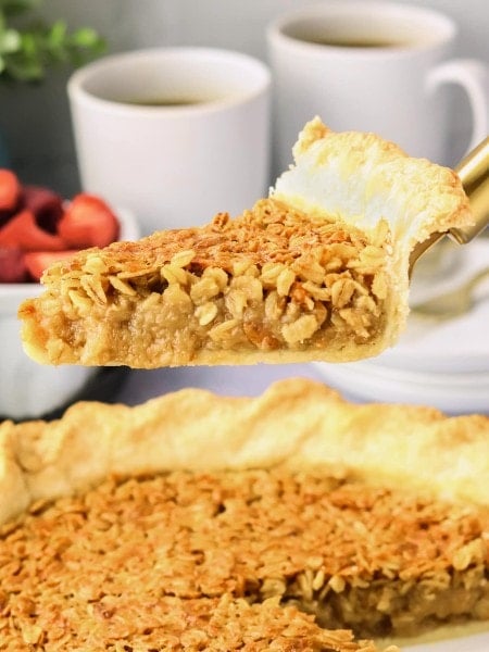 A slice of an Oatmeal Pie on a cake lifter.