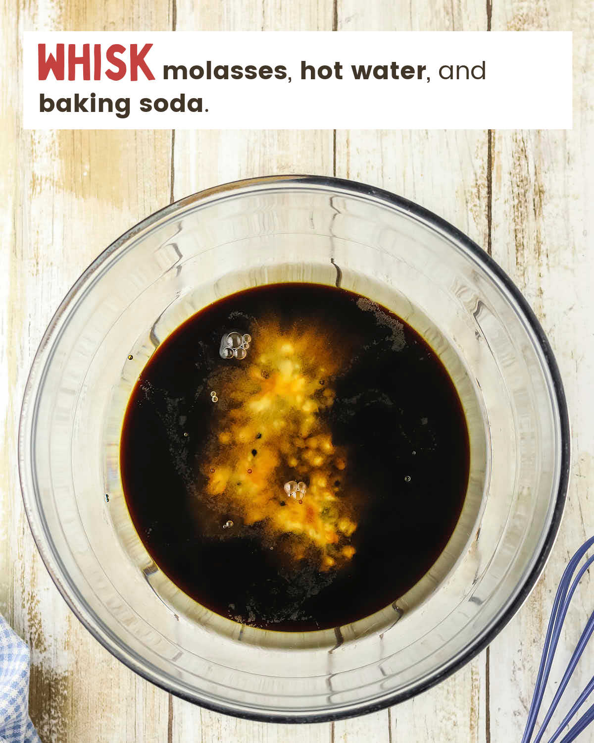 Molasses, hot water, and baking soda in a glass bowl. 