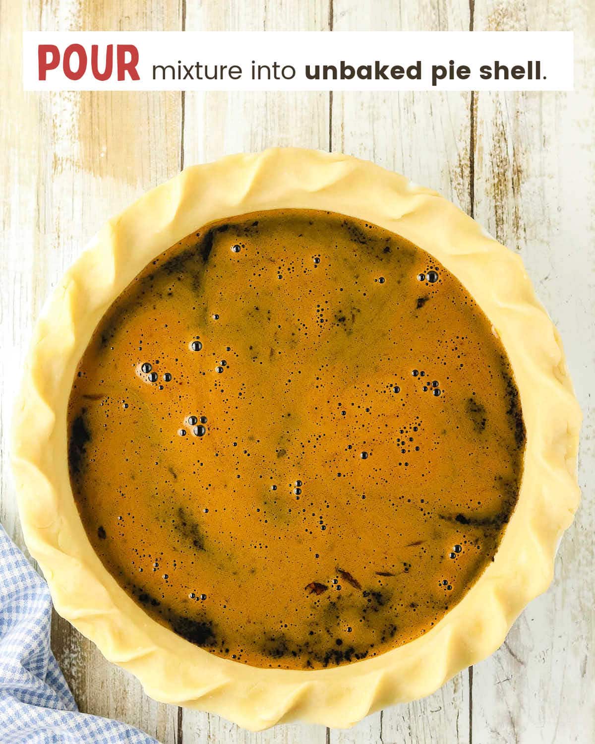 Molasses mixture in an unbaked pie crust.