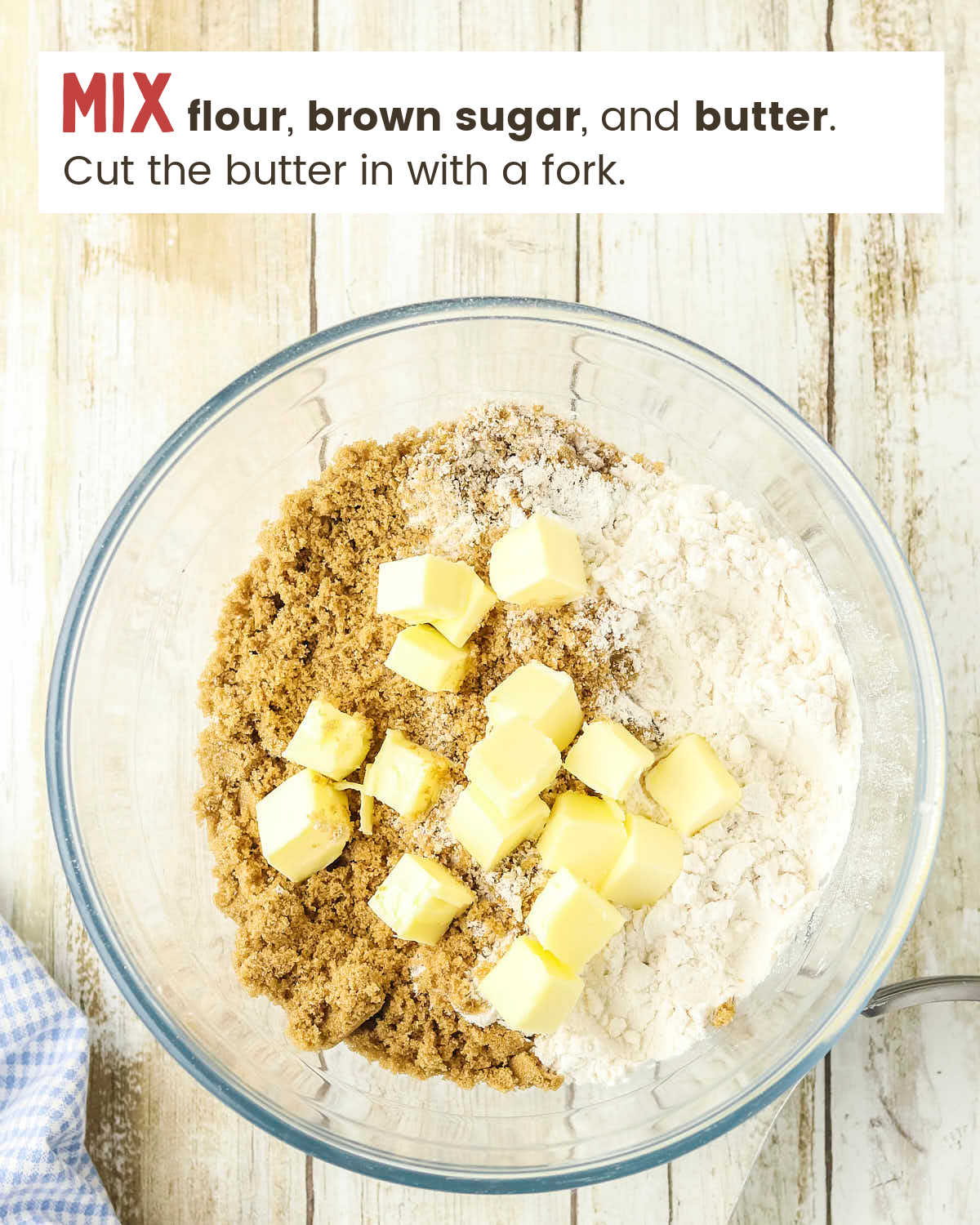 Flour, brown sugar, and butter cubes in a glass bowl.