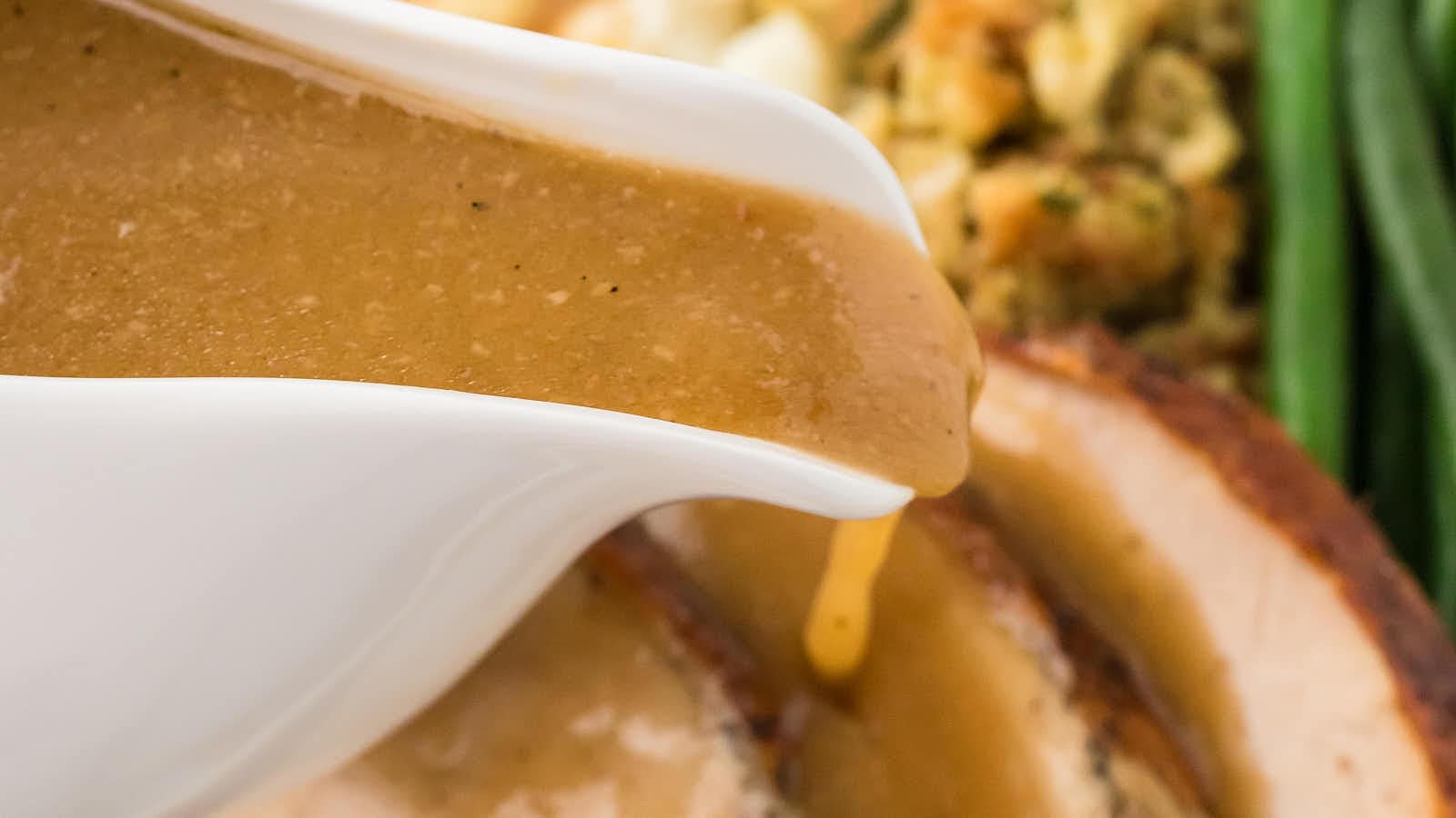 Pour Turkey Gravy over sliced Thanksgiving turkey.