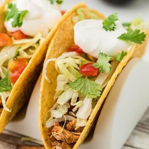 Closeup of a Turkey Tacos with toppings in a hardshell taco.