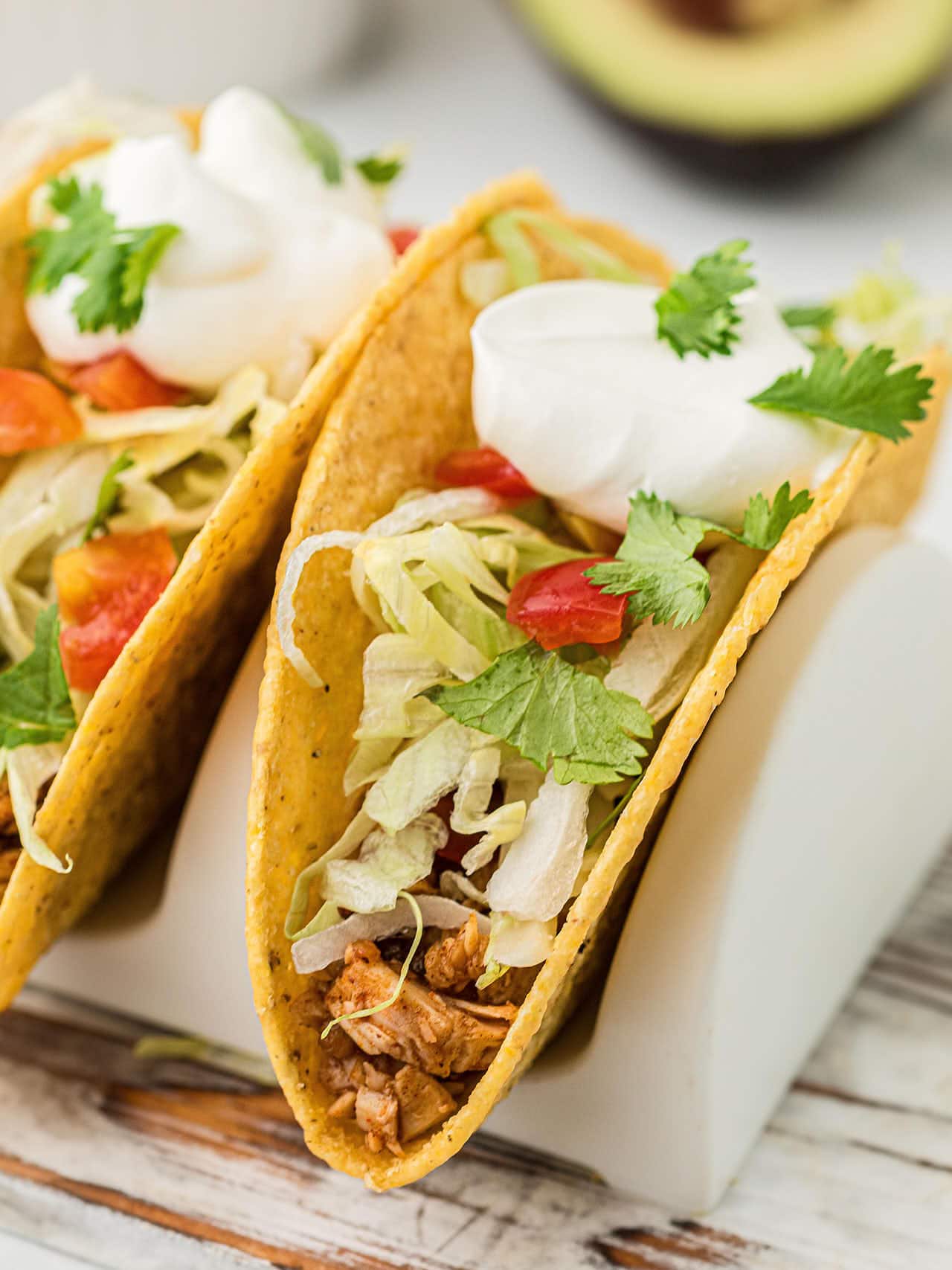 Closeup of a Turkey Tacos with toppings in a hardshell taco.