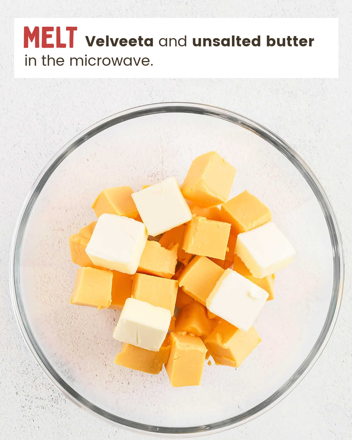 Diced Velveeta and butter in a large bowl.