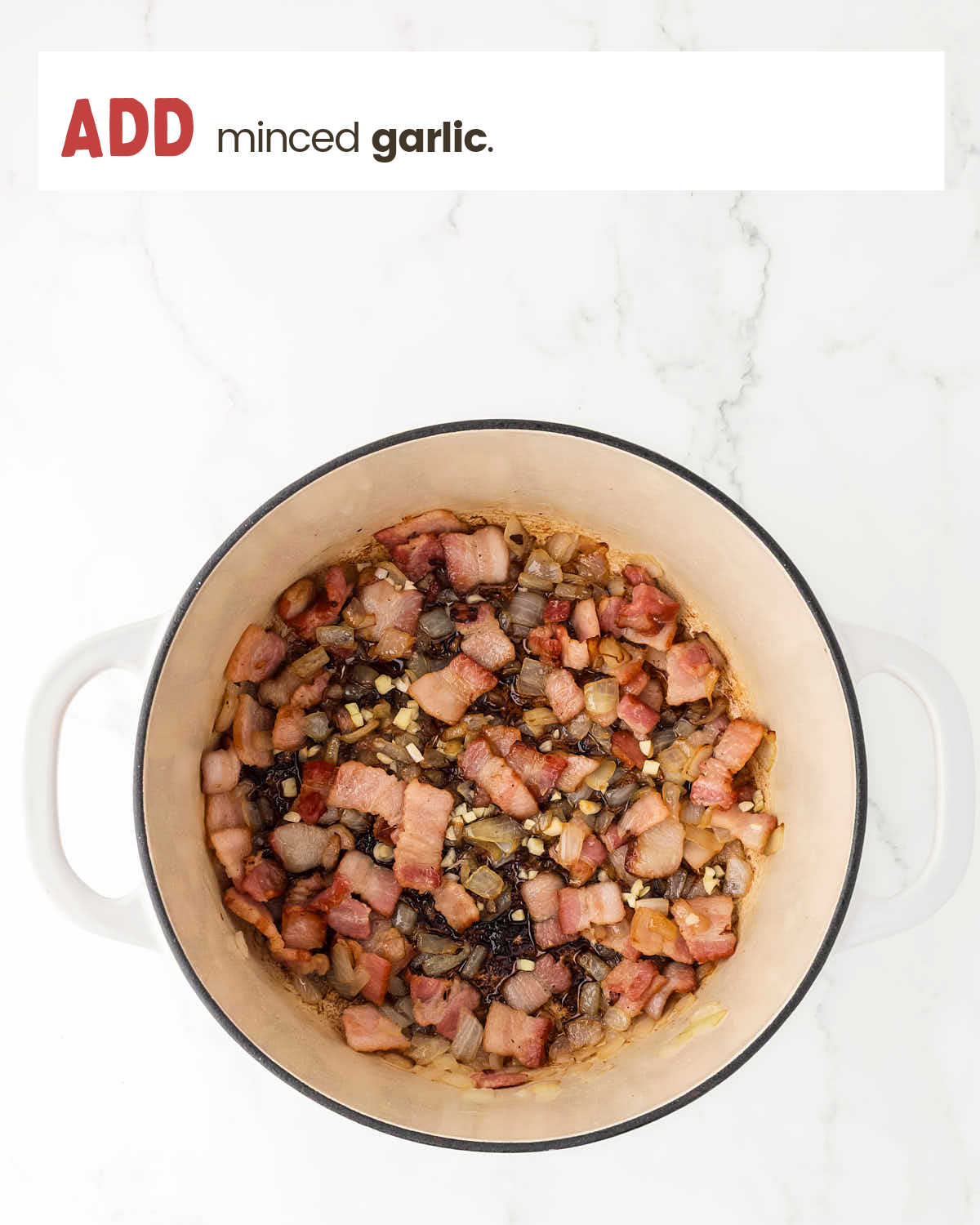 Minced garlic added to sautéed bacon and onions in a Dutch oven.