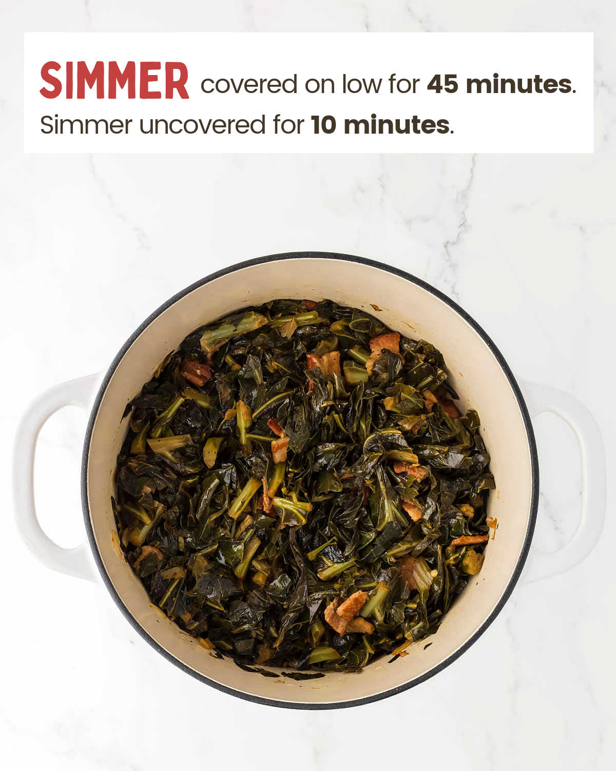 Collard greens simmering with bacon in a Dutch oven.