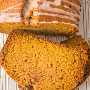 Pumpkin Bread slices with sugar glaze showing moist golden crumb.