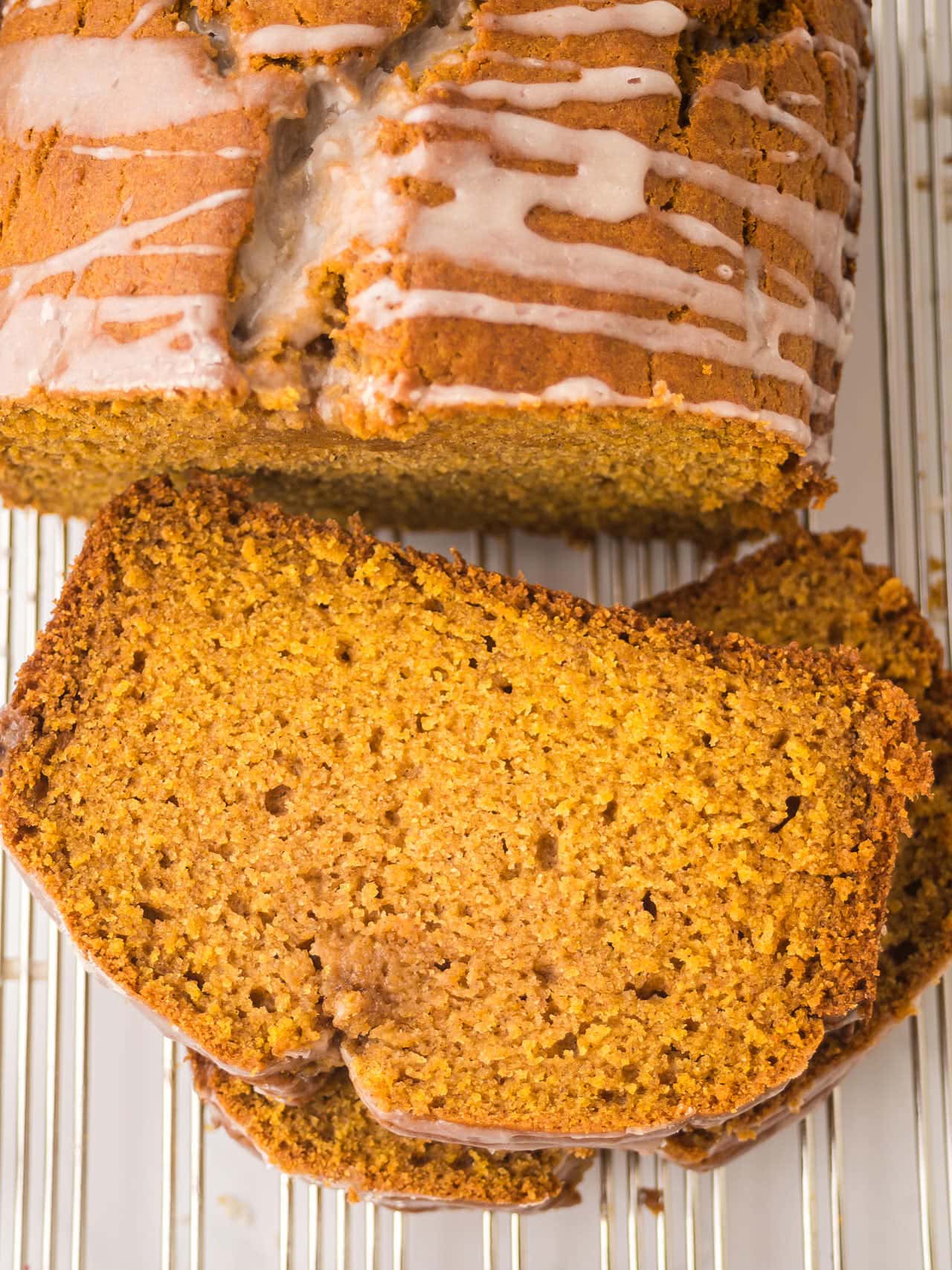 Pumpkin Bread slices with cinnamon sugar glaze showing moist golden crumb.