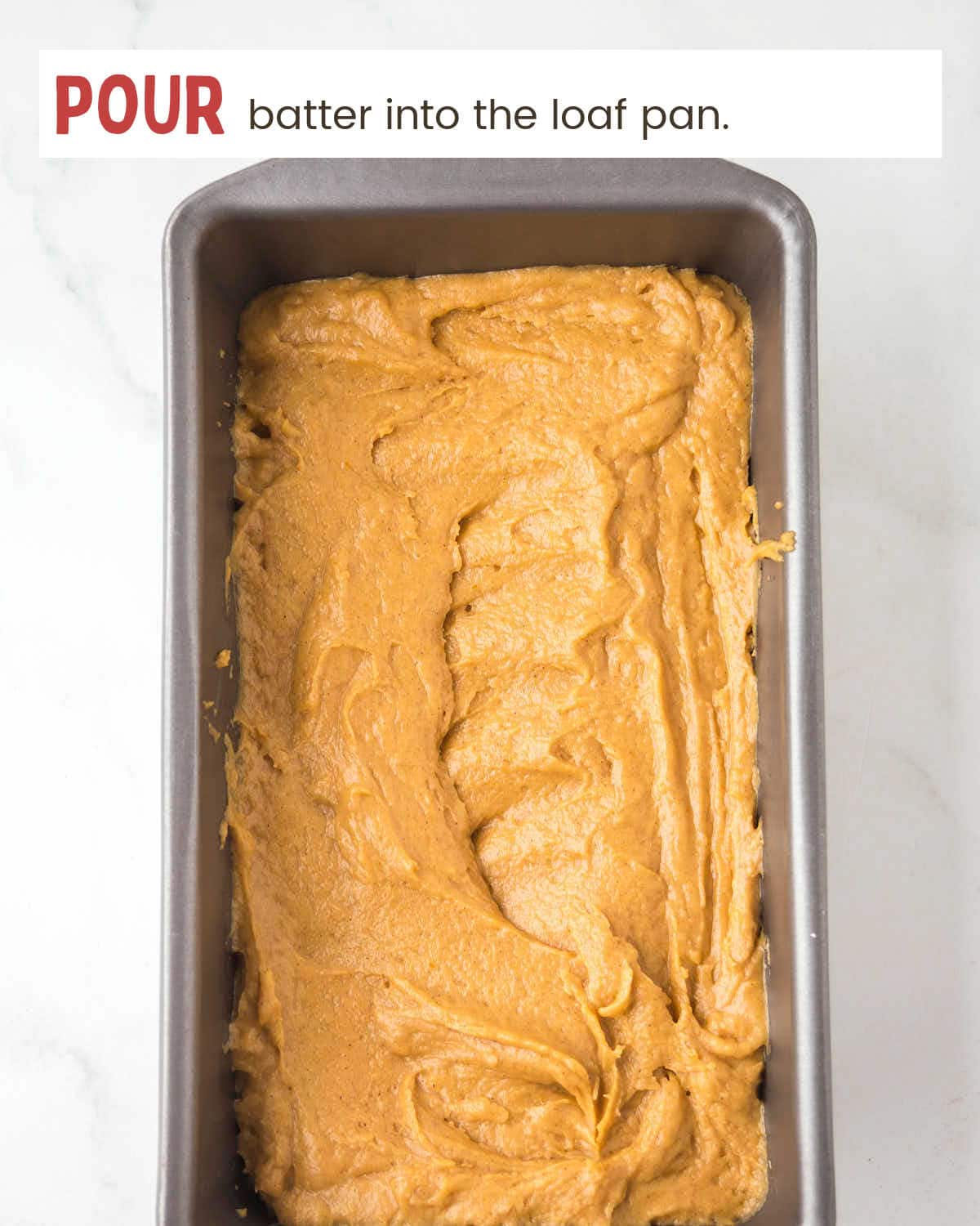 Pouring batter into a loaf pan.