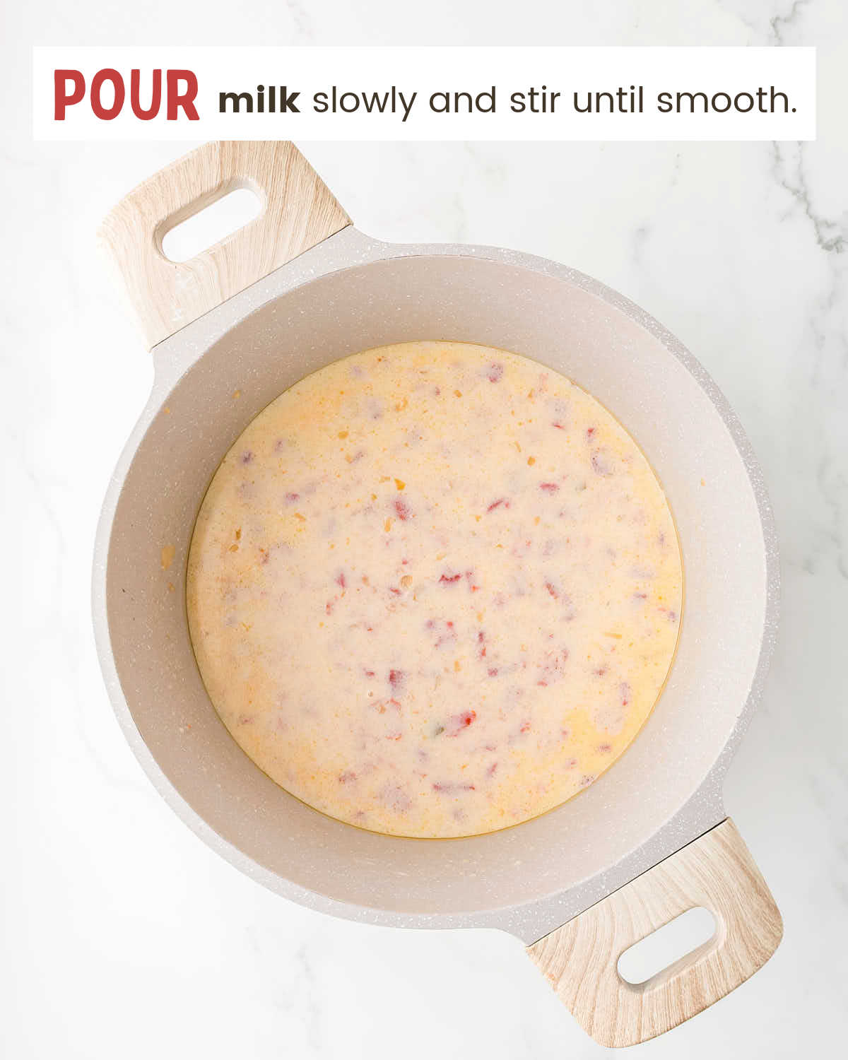 Pour milk slowly into the saucepan.