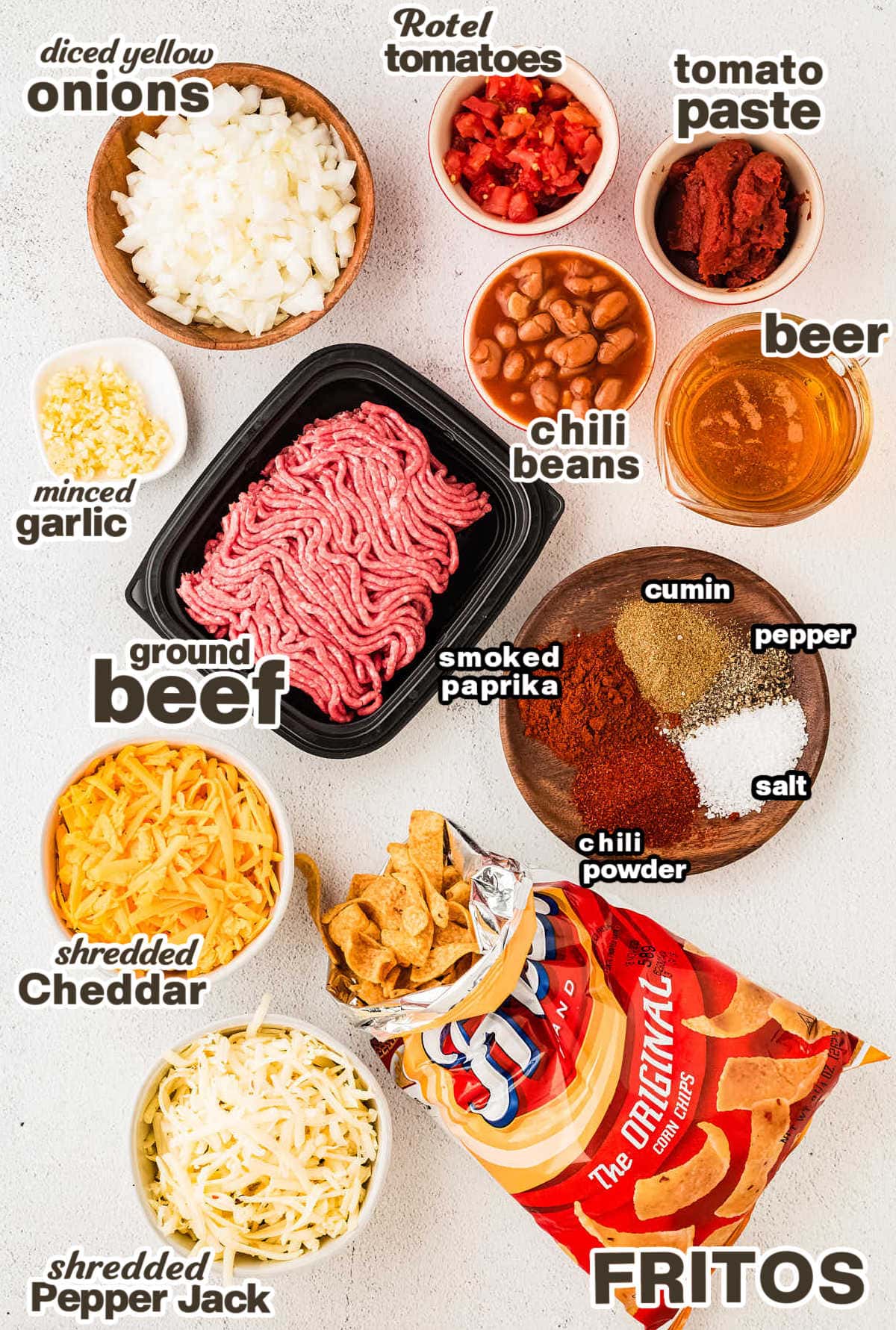 Ingredients needed to make a Frito Pie in a skillet.