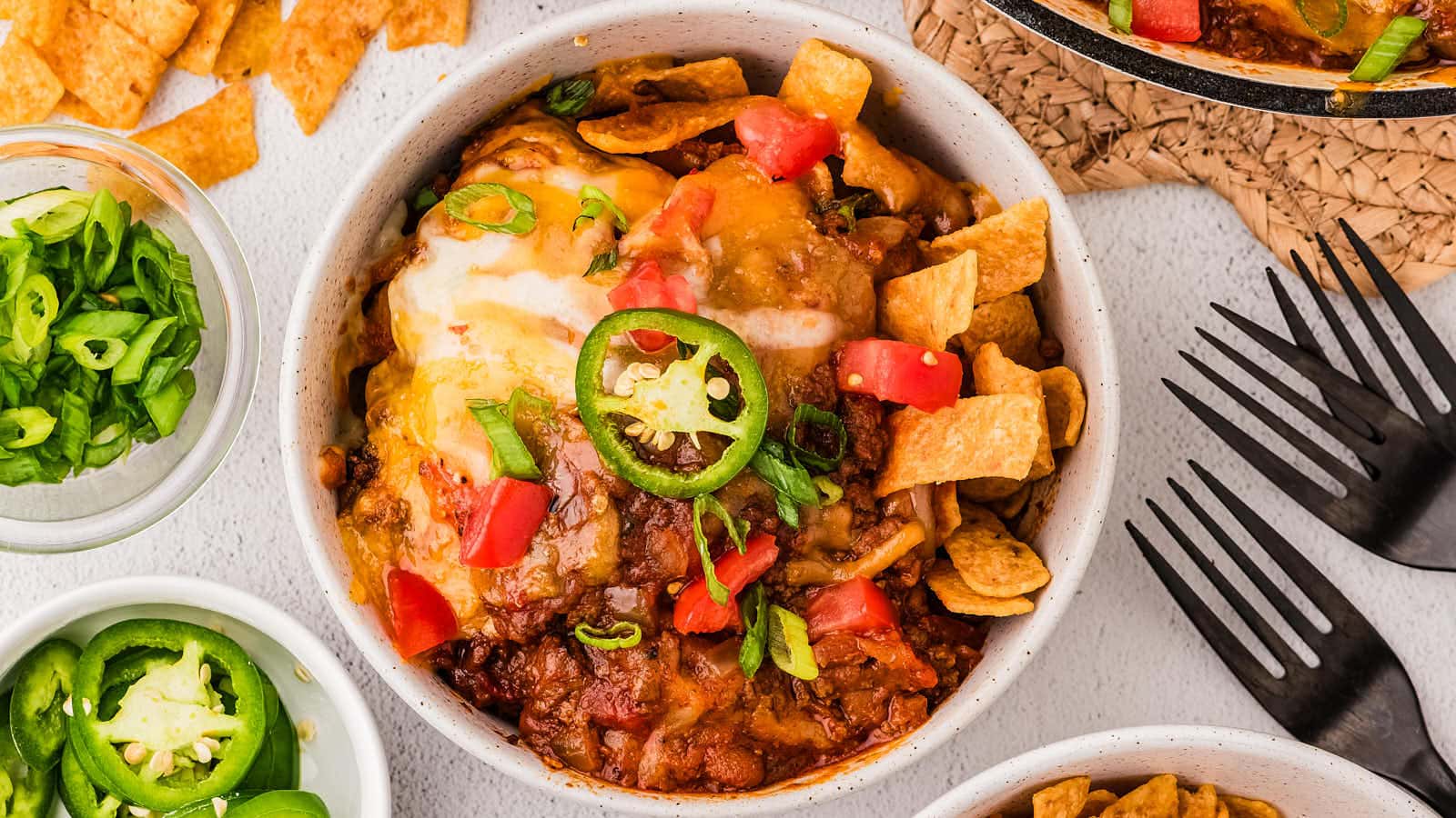 Frito Pie recipe in a white bowl.