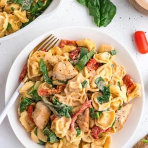Marry Me Chicken Tortellini with creamy sauce, spinach, sun-dried tomatoes, and tender chicken.