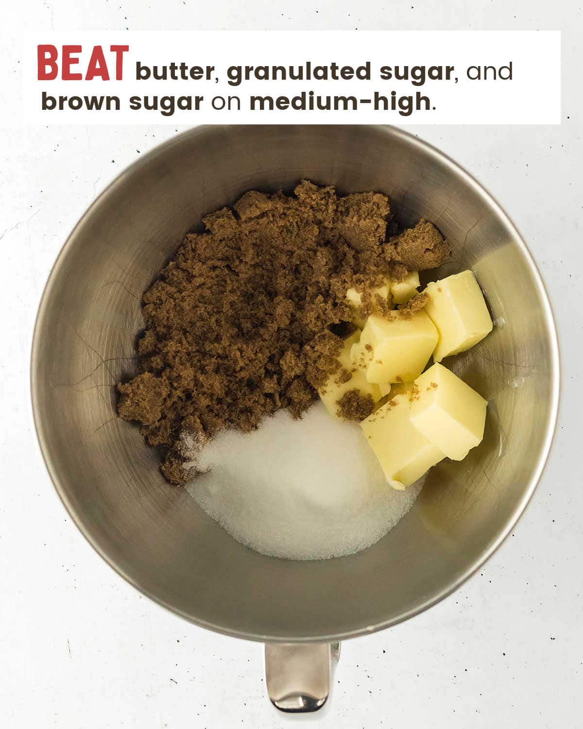 Beating sugars and butter in a stand mixer.
