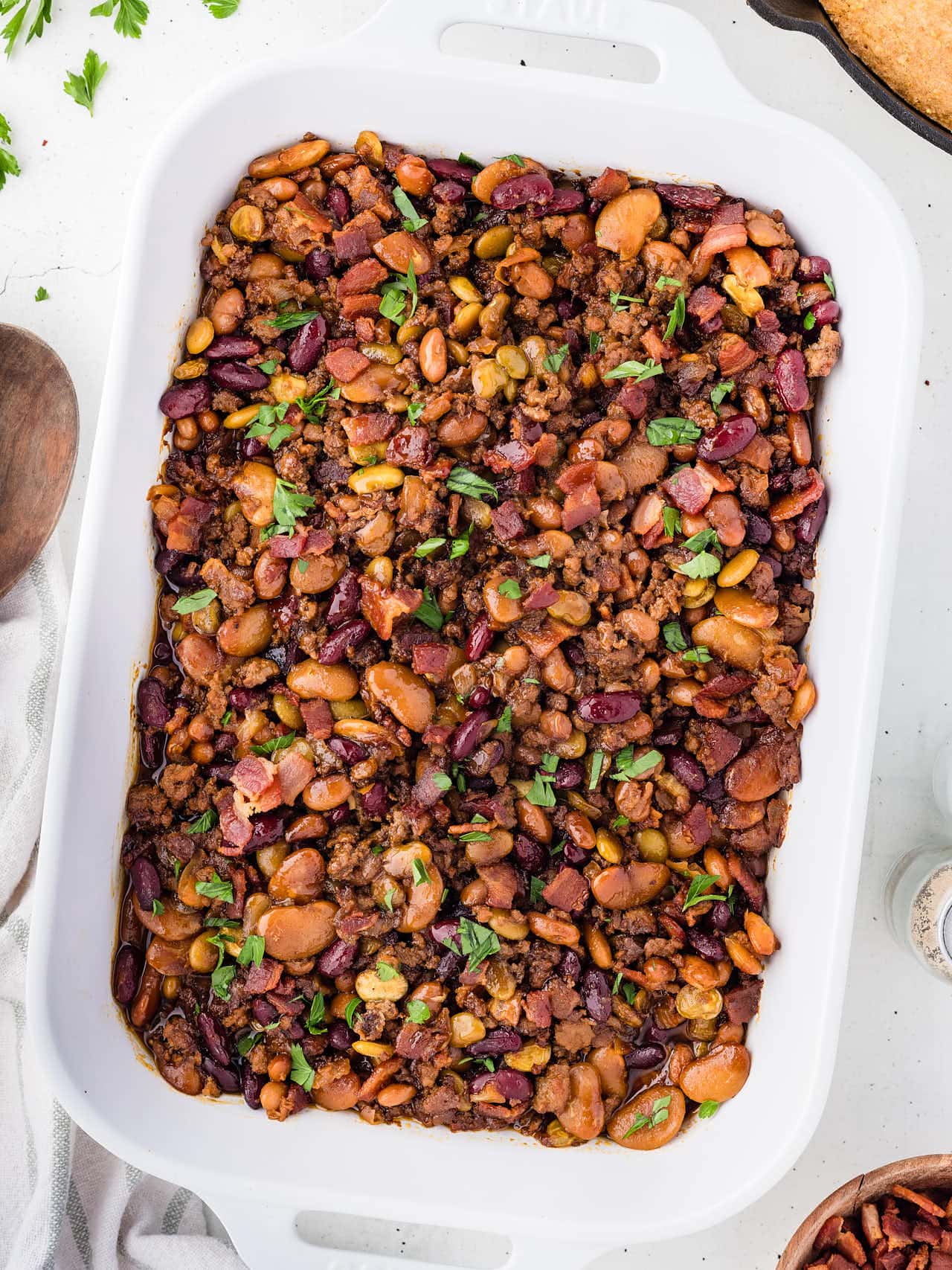Casserole dish with baked Cowboys Beans.