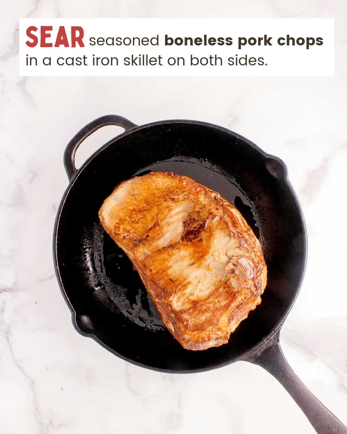 Sear pork chops in a cast iron skillet. 