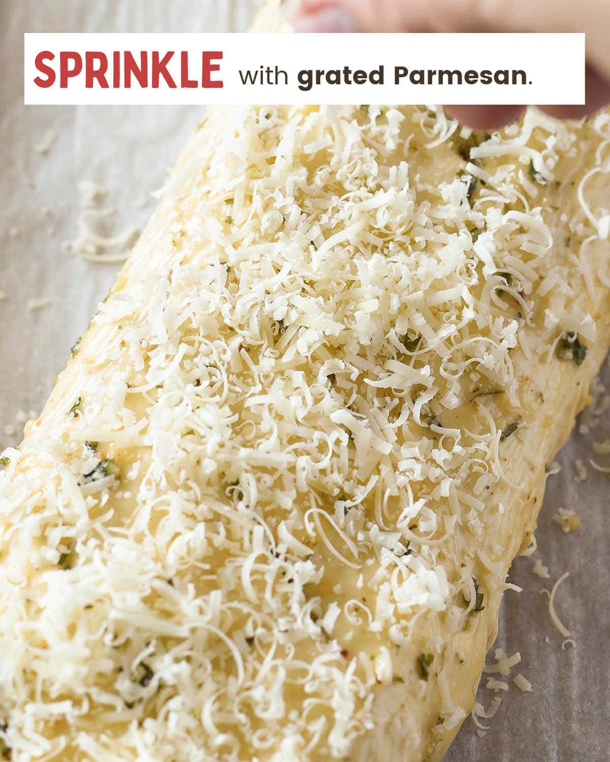 Sprinkle the log with grated Parmesan cheese.