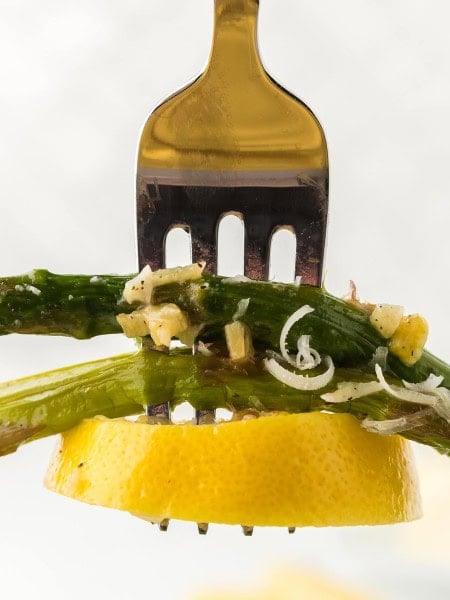 Closeup of a forkful of Oven Roasted Asparagus.