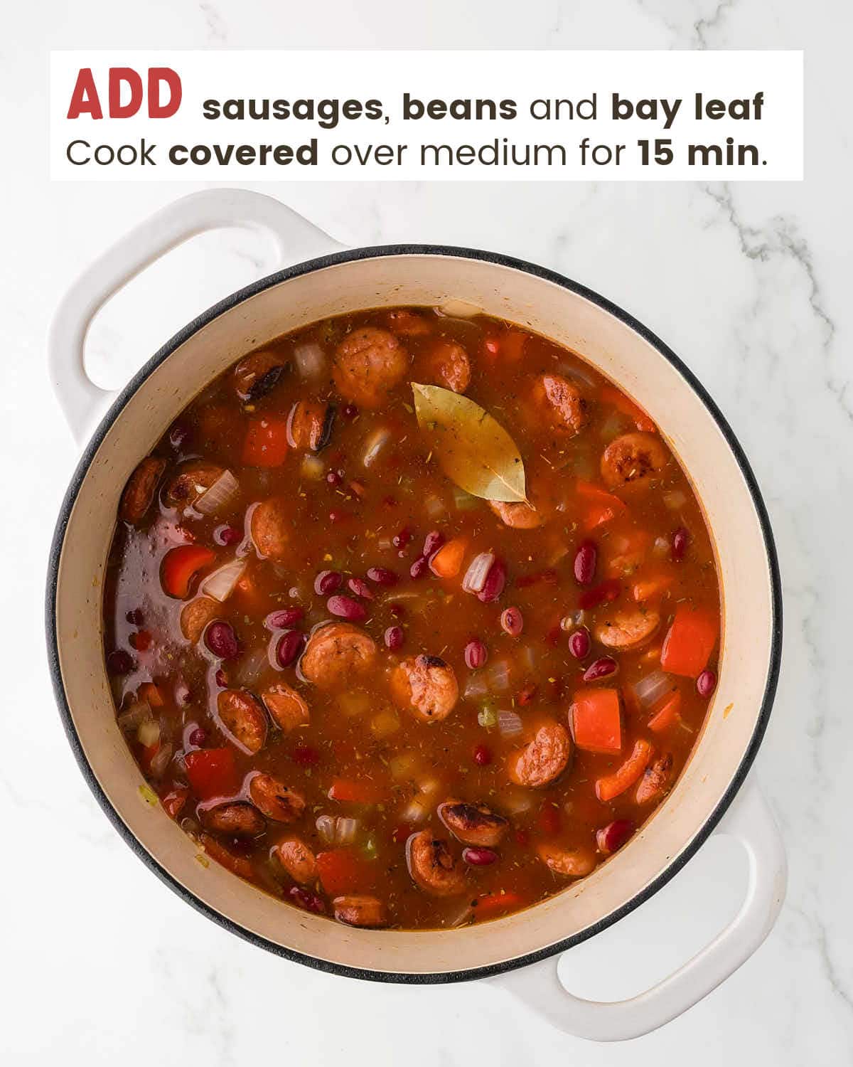 Added beans, sausage, and bay leaves.