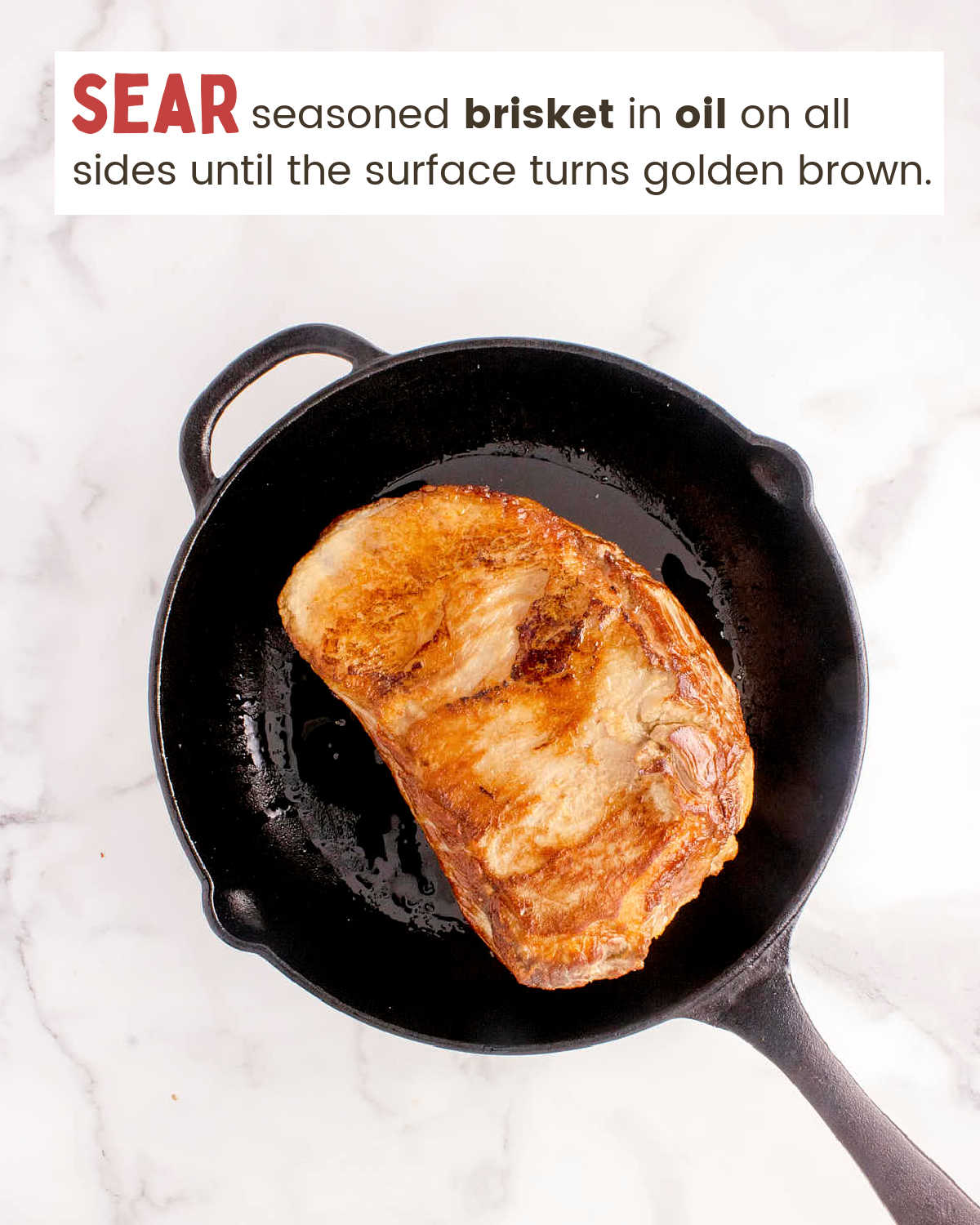 Seared brisket in a skilet.