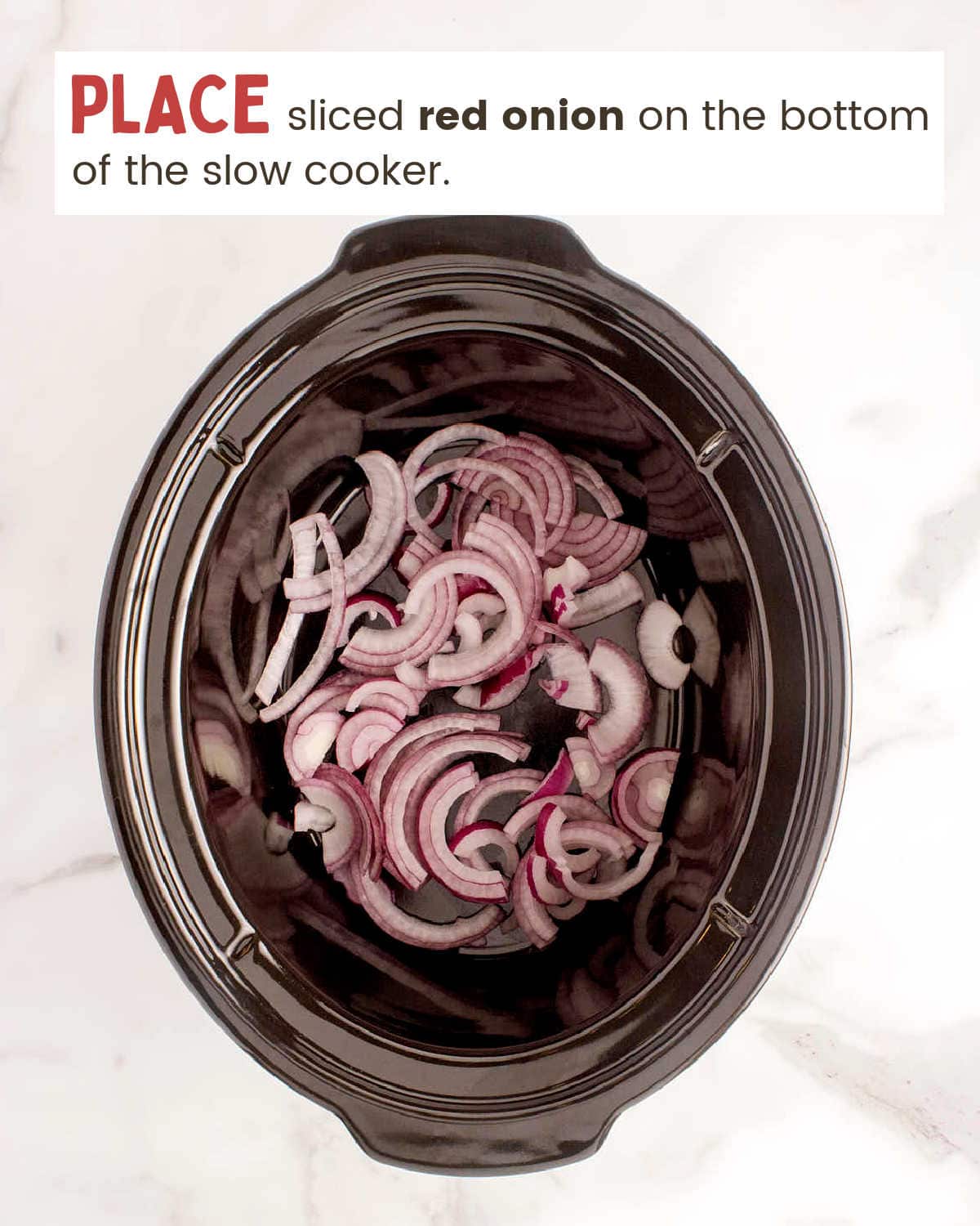 Sliced red onion in the slow cooker.