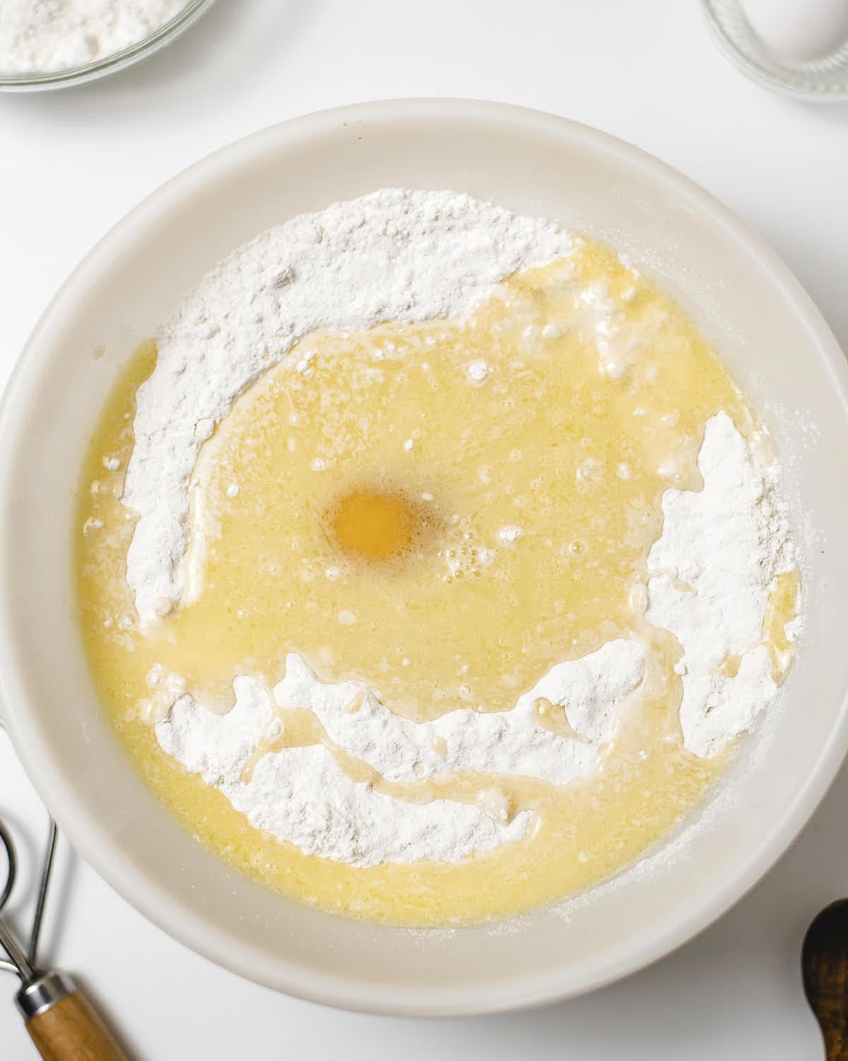 Melted butter and dry ingredients mixed in large bowl.