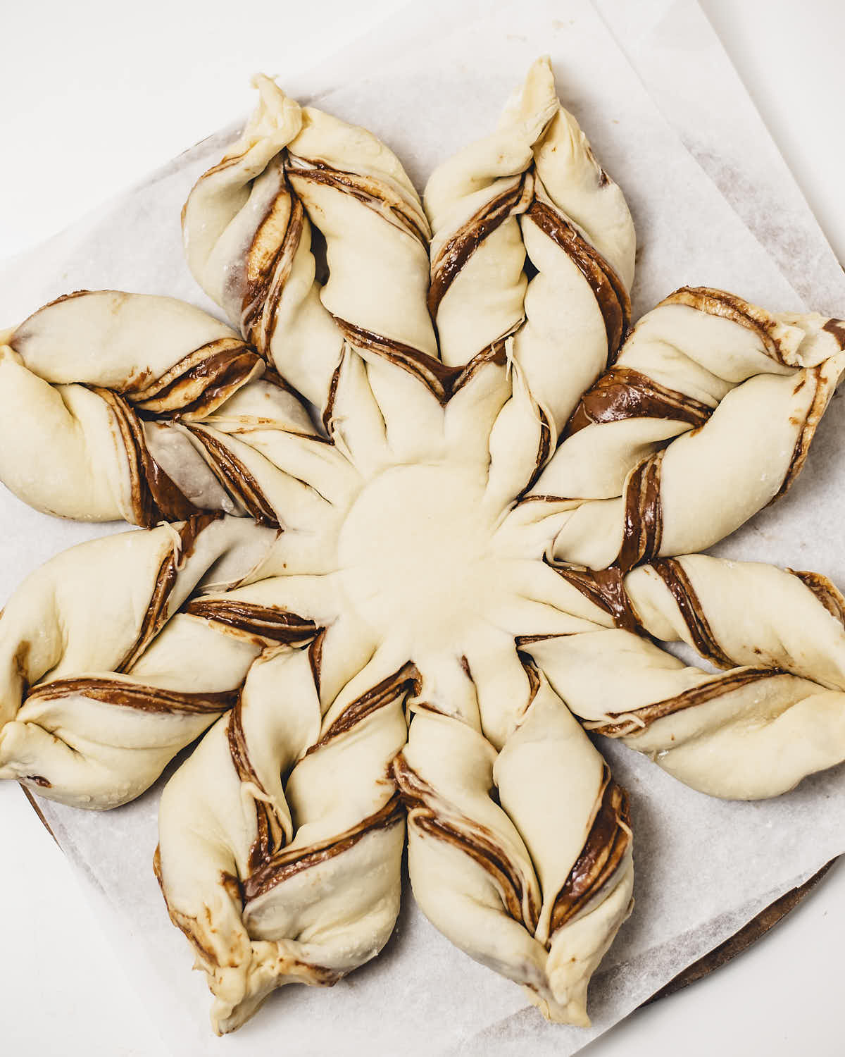 Folding the ends of the dough sliced dough indentations.
