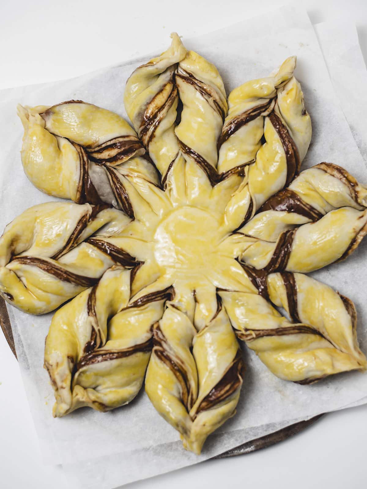 Star Bread with an egg wash.