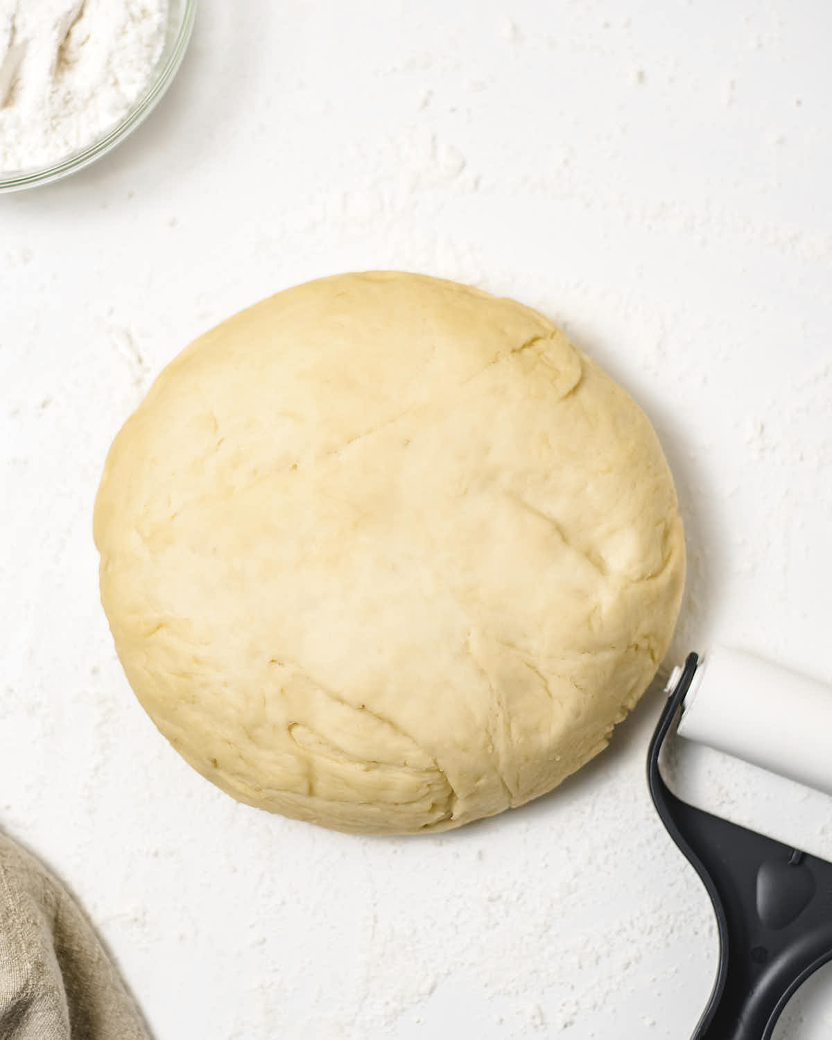 Dough shaped into a large dough ball.