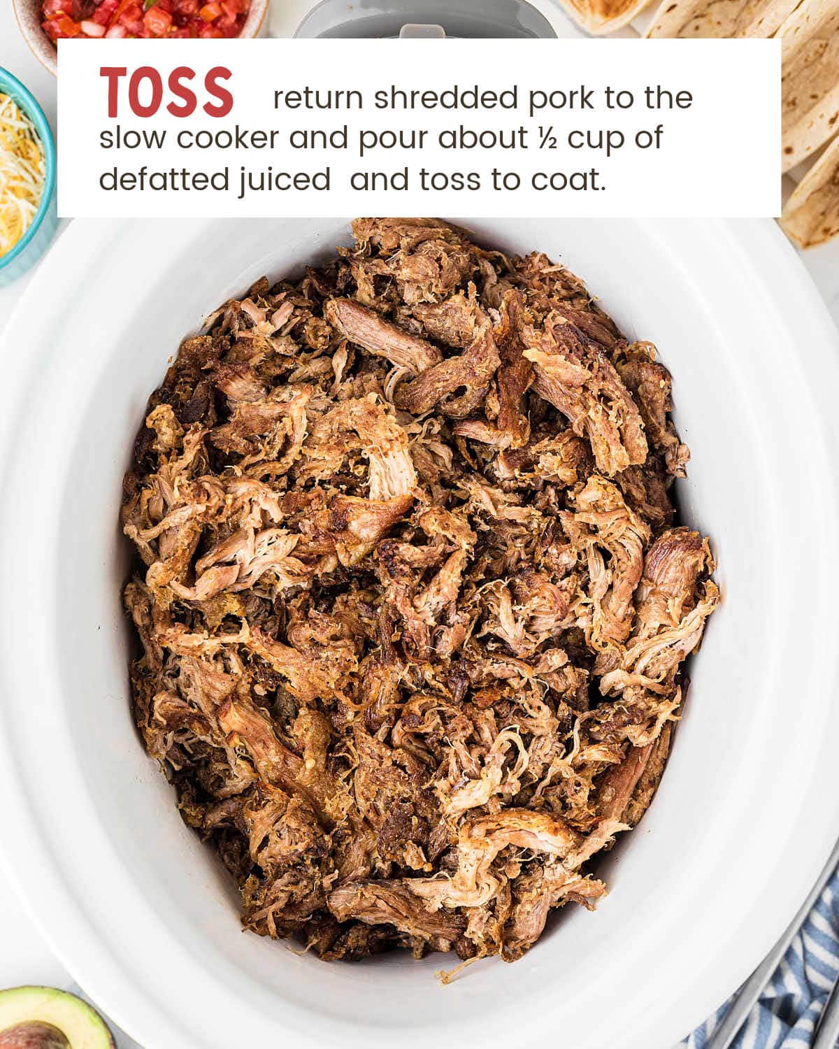 Finished slow cooker carnitas with crispy caramelized edges ready to serve.