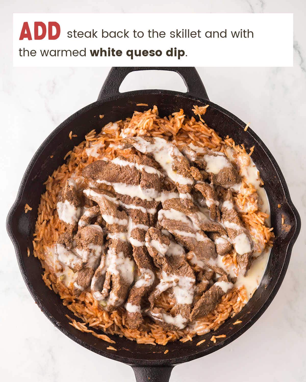 Cast iron skillet with the cooked steak and warmed queso sauce.