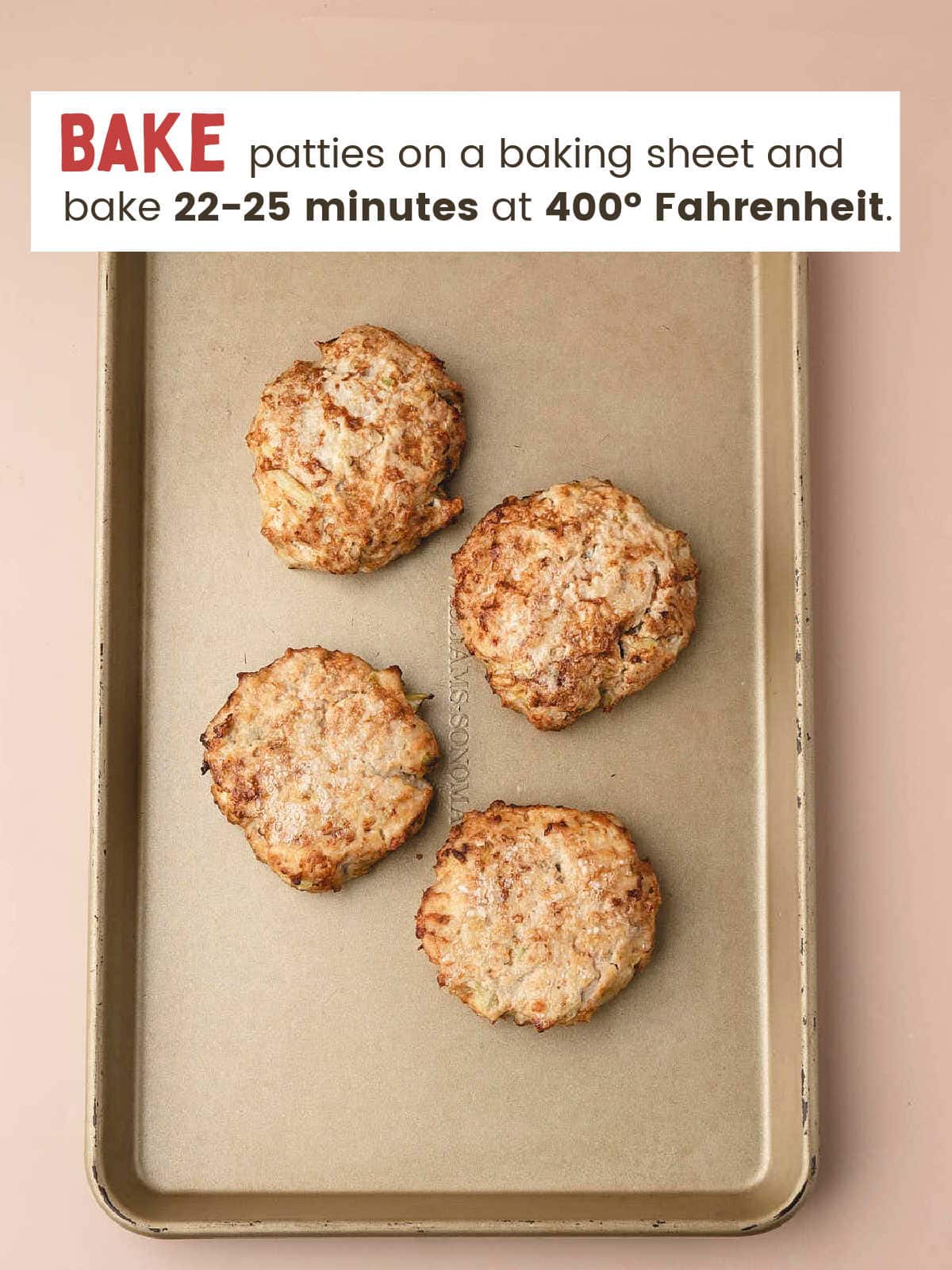 Four golden baked Buffalo Chicken Burger patties on a baking sheet.
