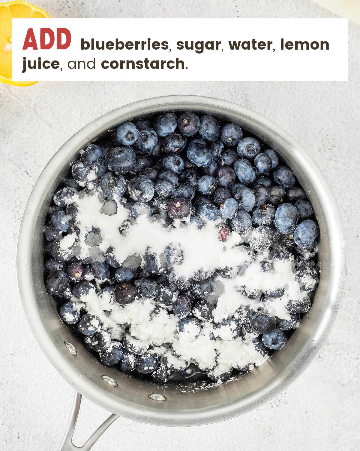 Fresh blueberries, sugar, and cornstarch in a saucepan before cooking.