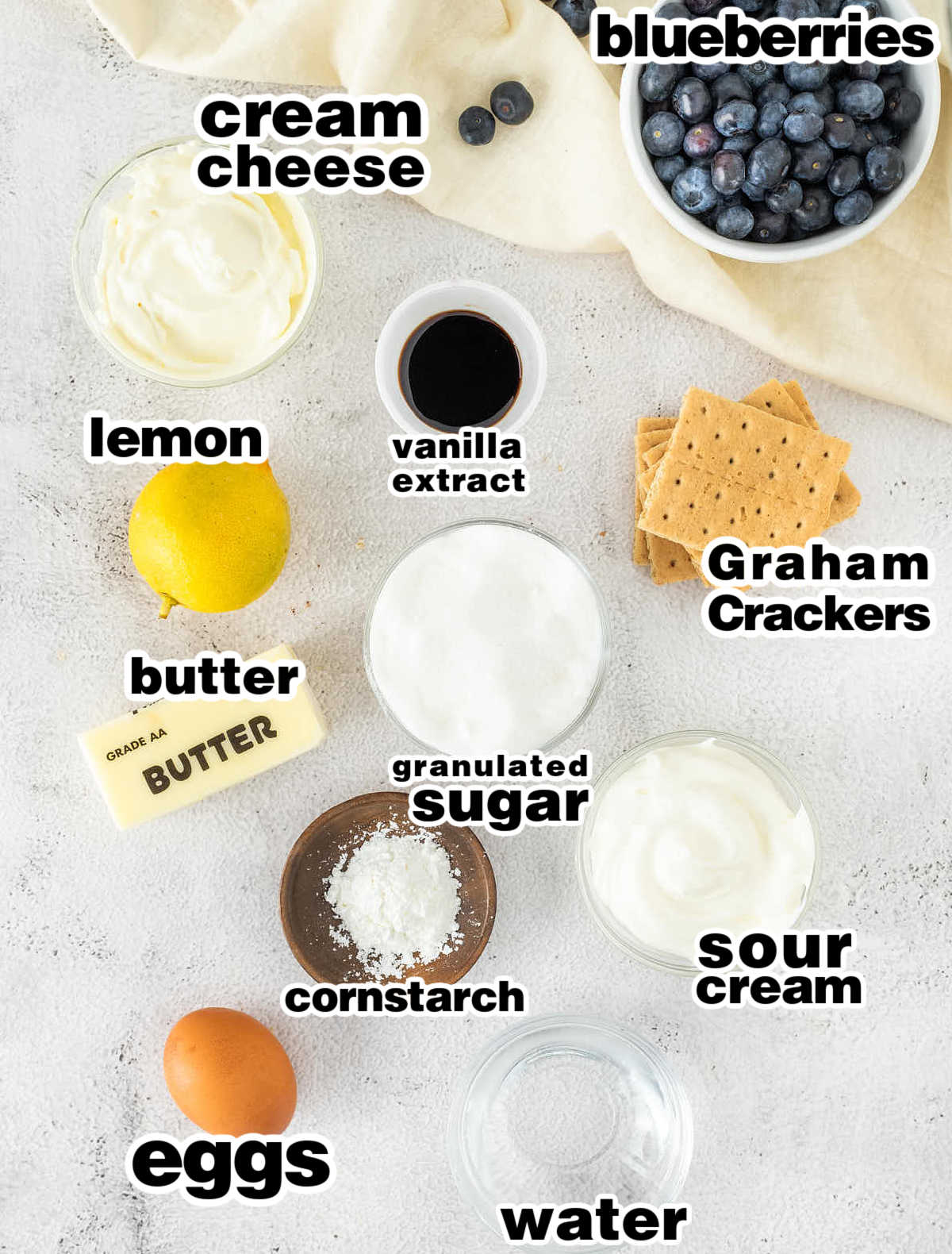 Ingredients needed to make a classic Blueberry Cheesecake.