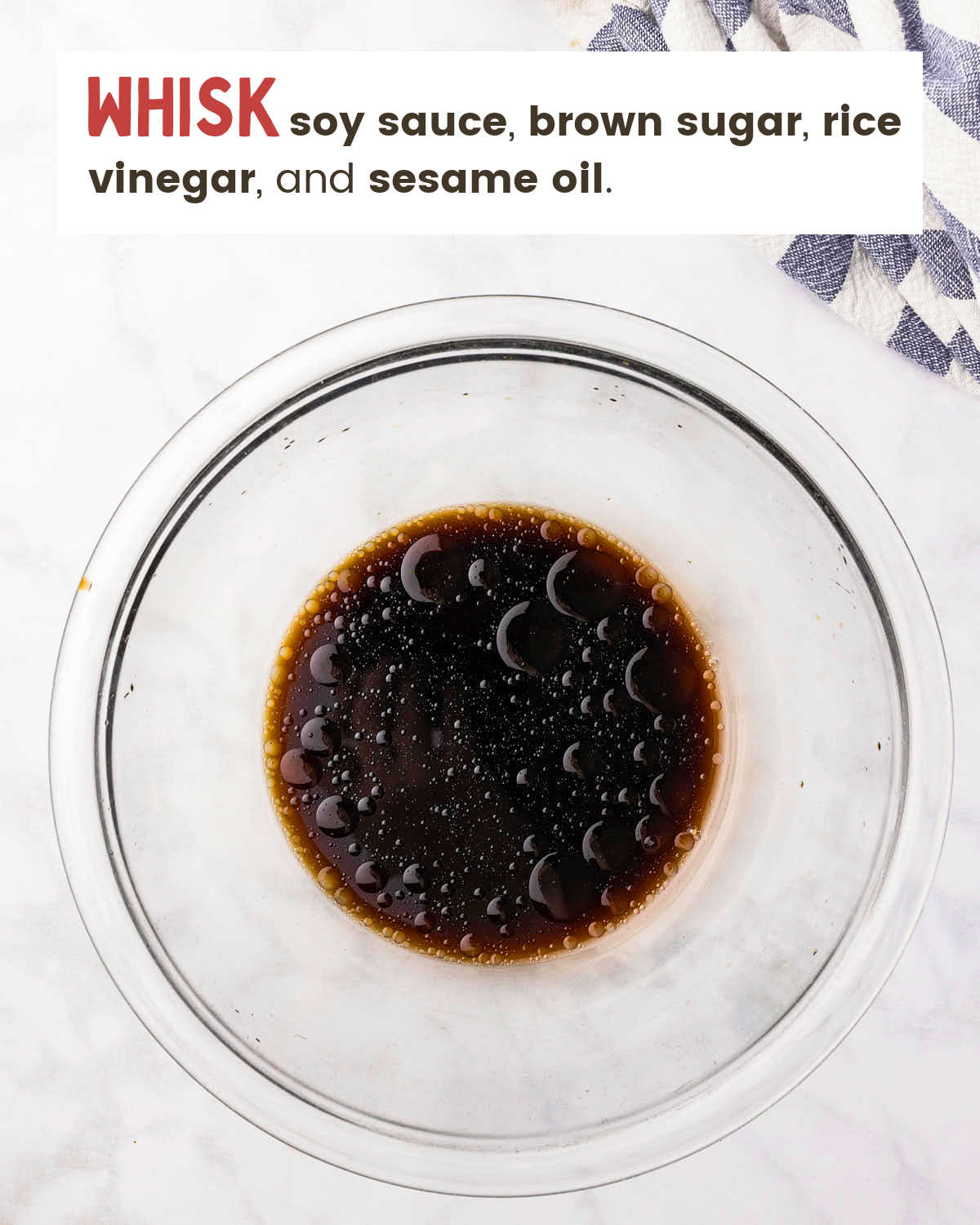 Stir fry sauce whisked together in a glass bowl.