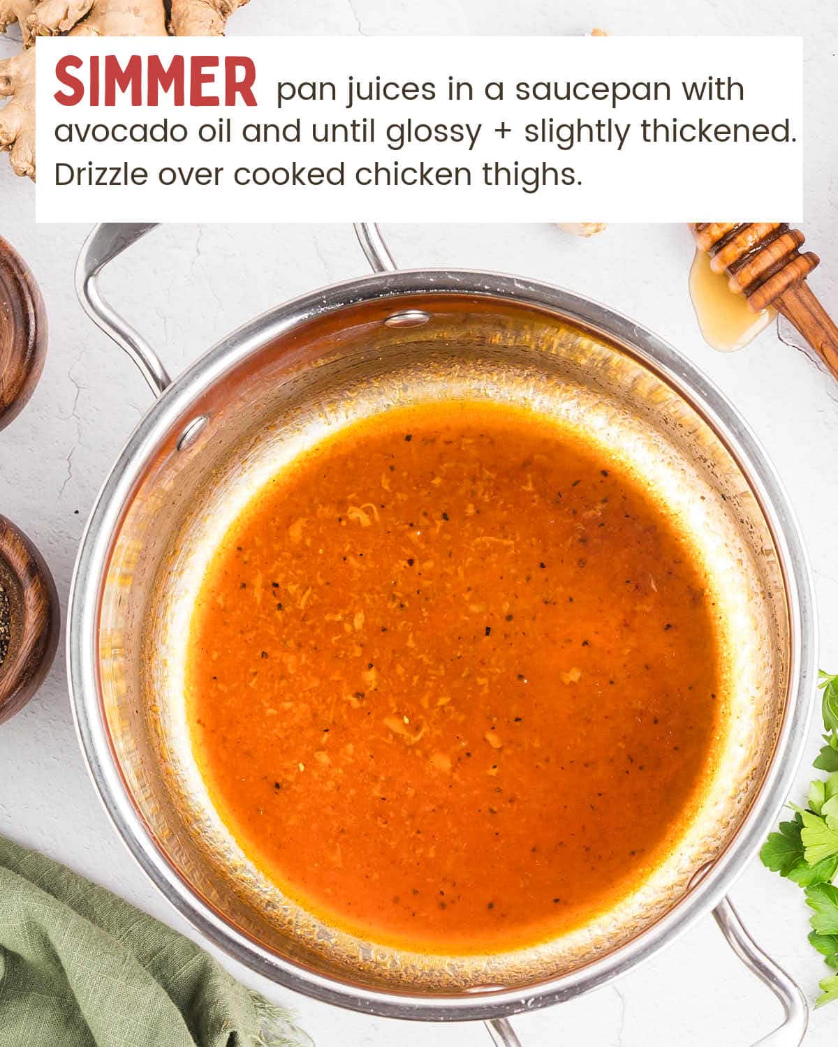 Honey garlic sauce simmering in a small saucepan until glossy and slightly thickened.