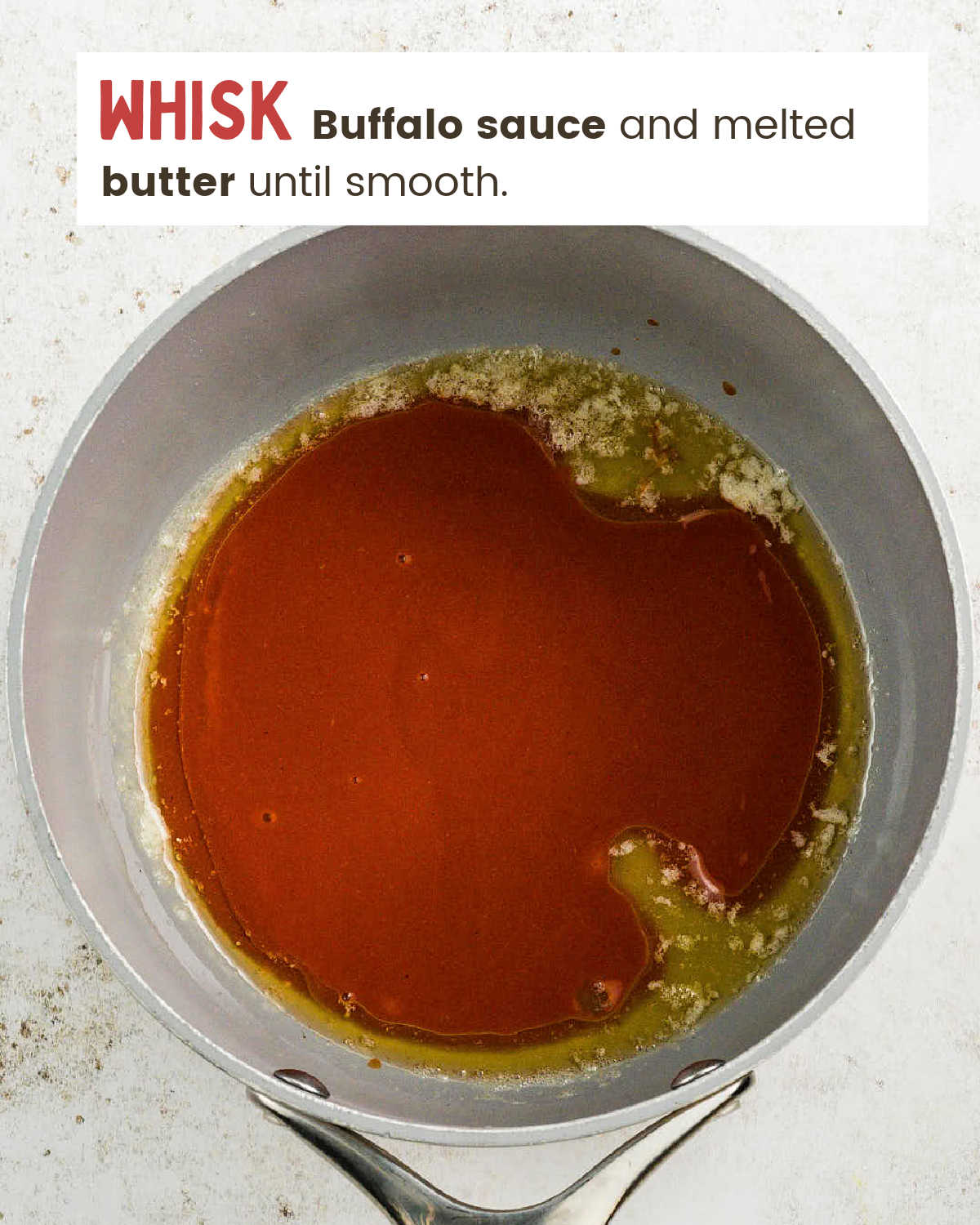Buffalo sauce and melted butter whisked together in a saucepan.