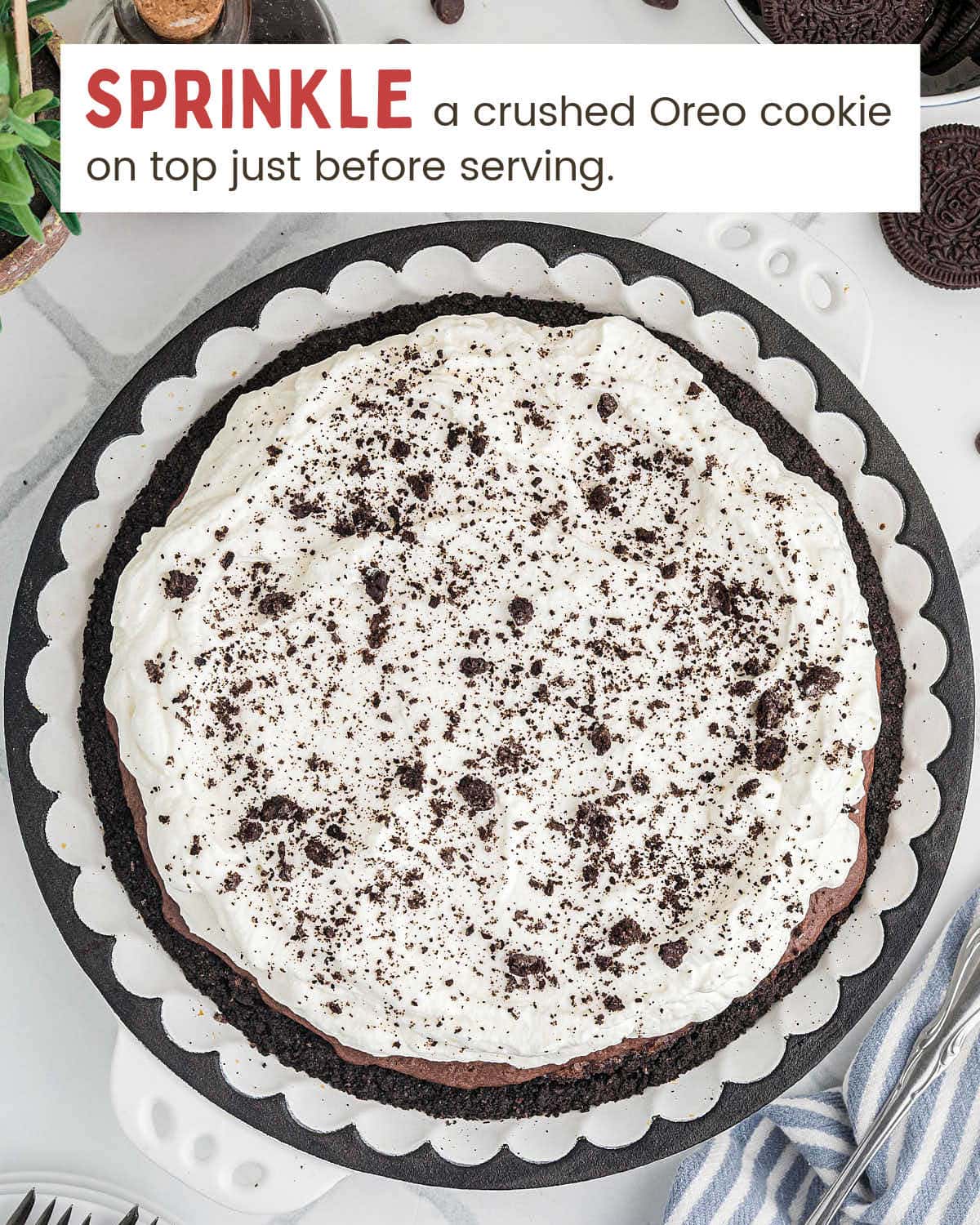 Mississippi Mud Pie garnished with crushed cookies and ready to slice.
