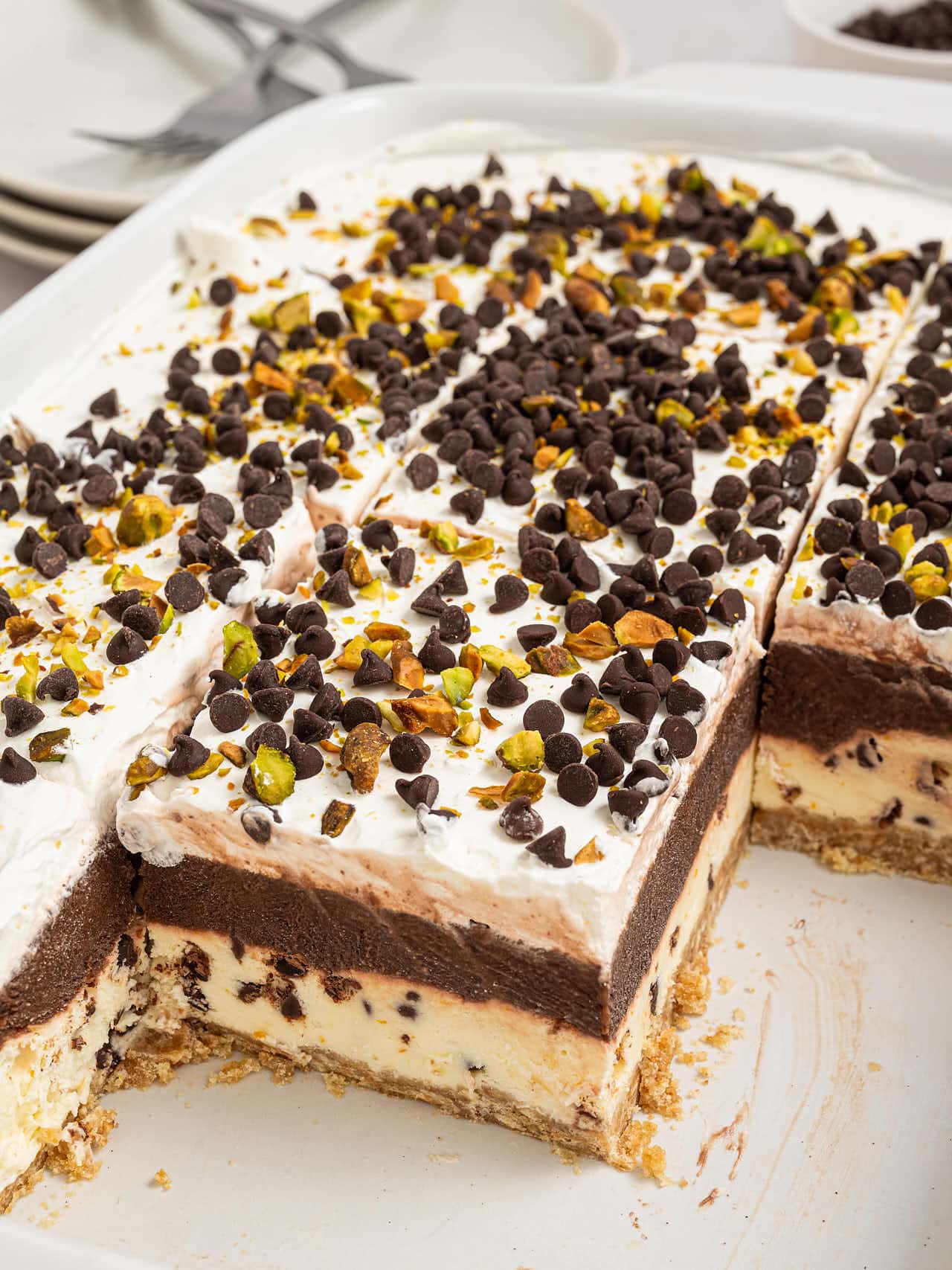 Cannoli Delight in a baking dish with several squares removed to show the layers.