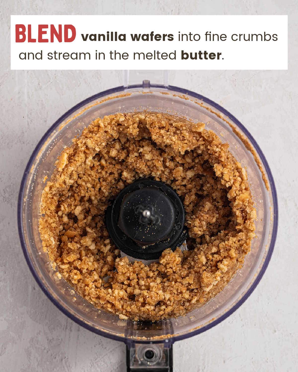 Vanilla wafer crumbs mixed with melted butter in a food processor.