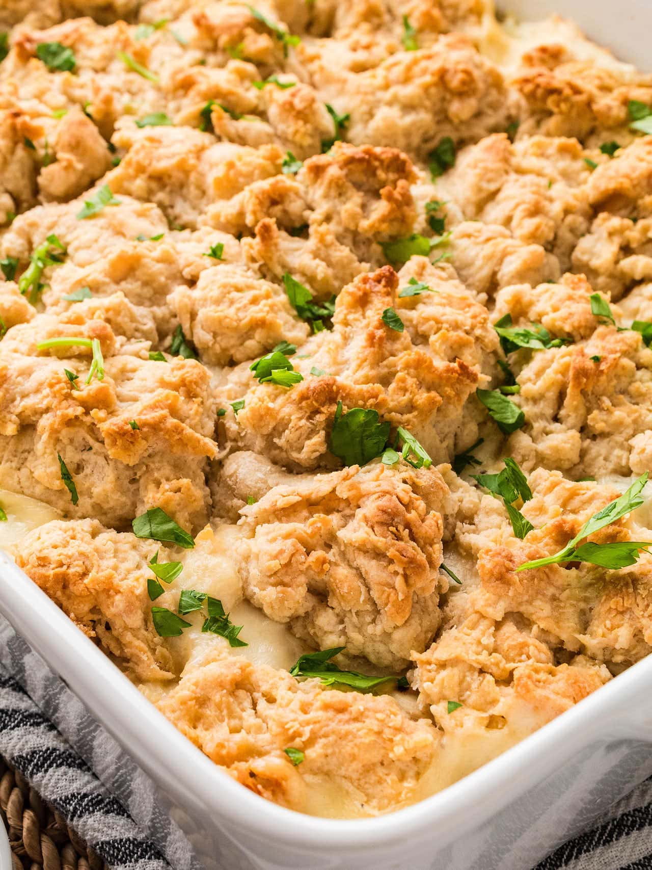 Close-up of the golden biscuit topping on a baked Chicken Cobbler.