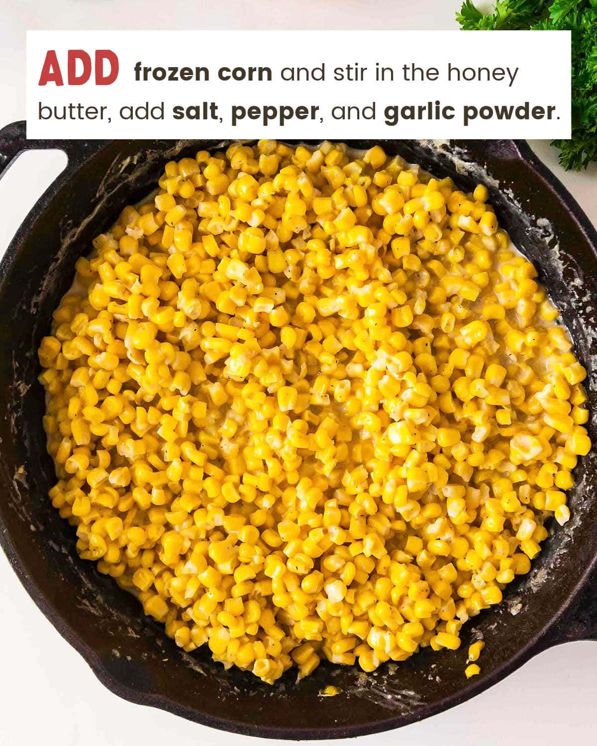 Frozen corn and seasoning added to the honey butter in the skillet.