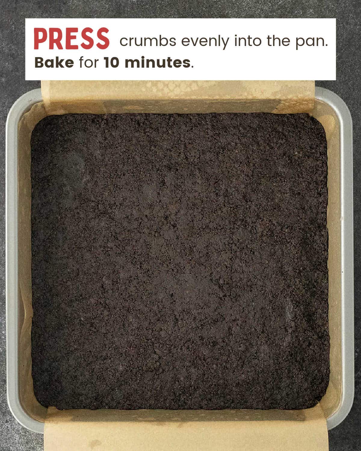 Oreo crust pressed into a parchment-lined 9x9 baking pan.
