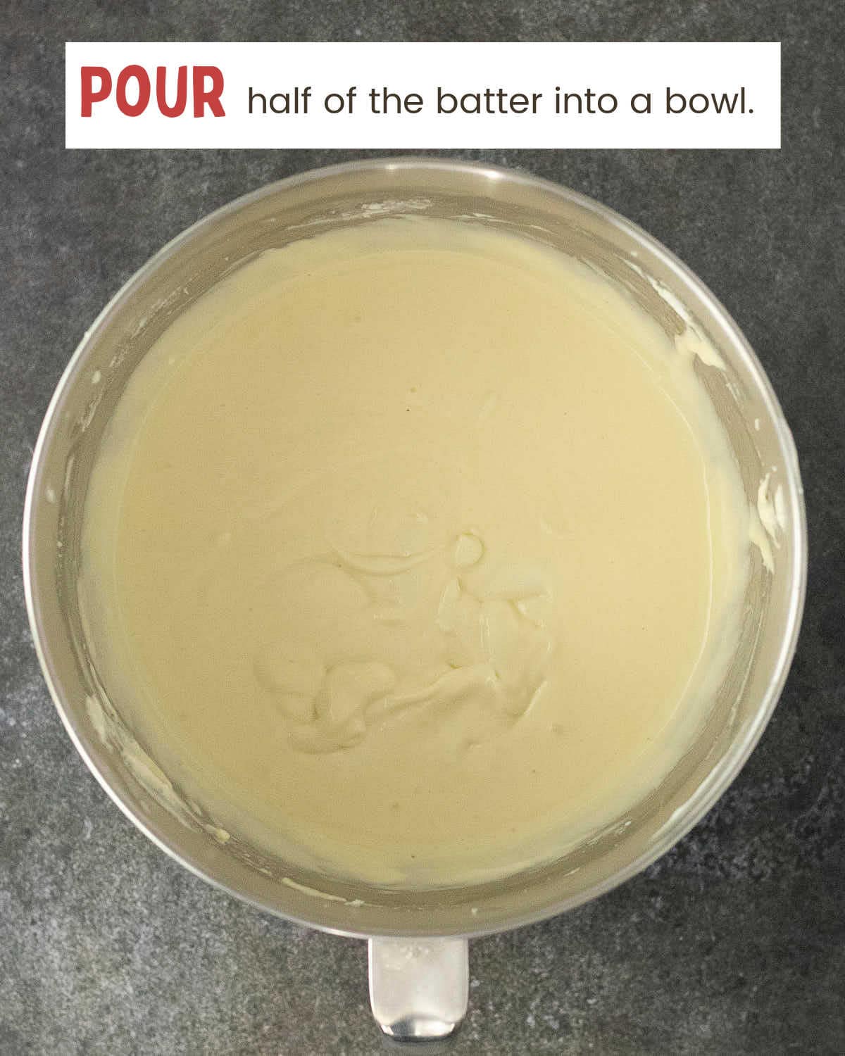 Smooth vanilla cheesecake filling beaten in a stand mixer bowl.