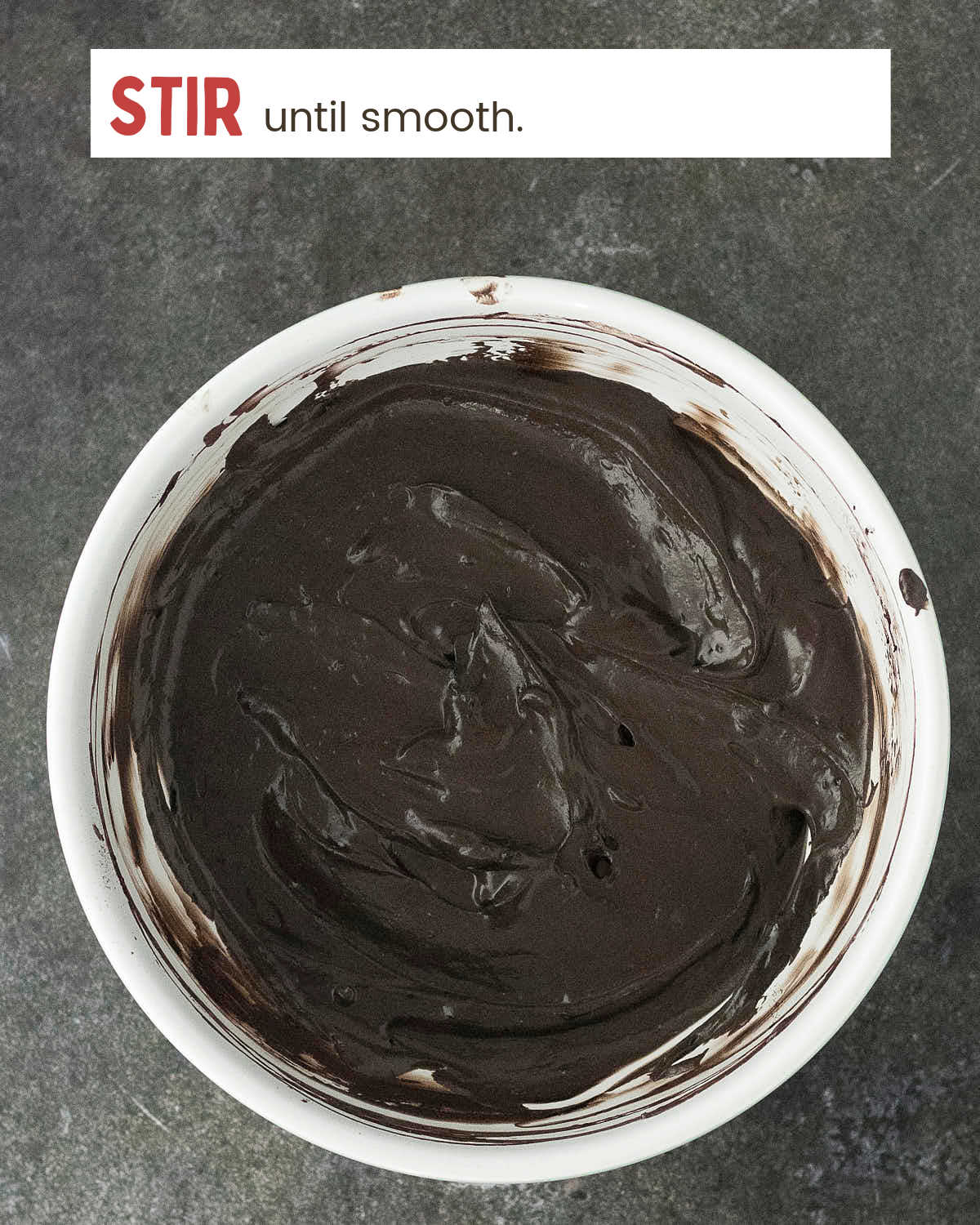 Black cocoa cheesecake batter stirred until smooth.