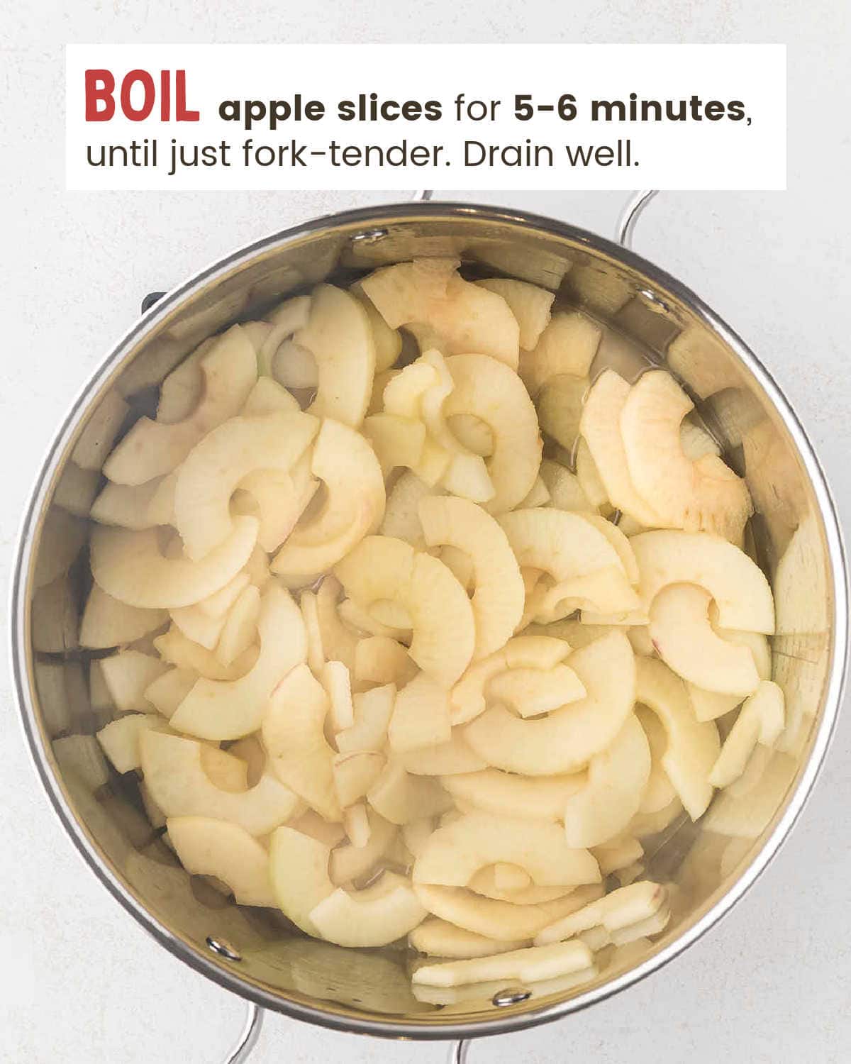 Apple slices boiling in a pot of water for Apple Cobbler.