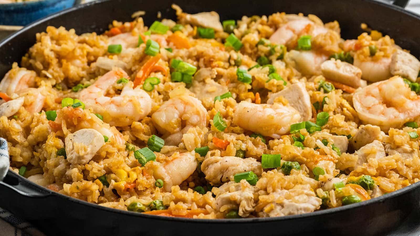 Close view of Chicken and Shrimp Fried Rice in the skillet.