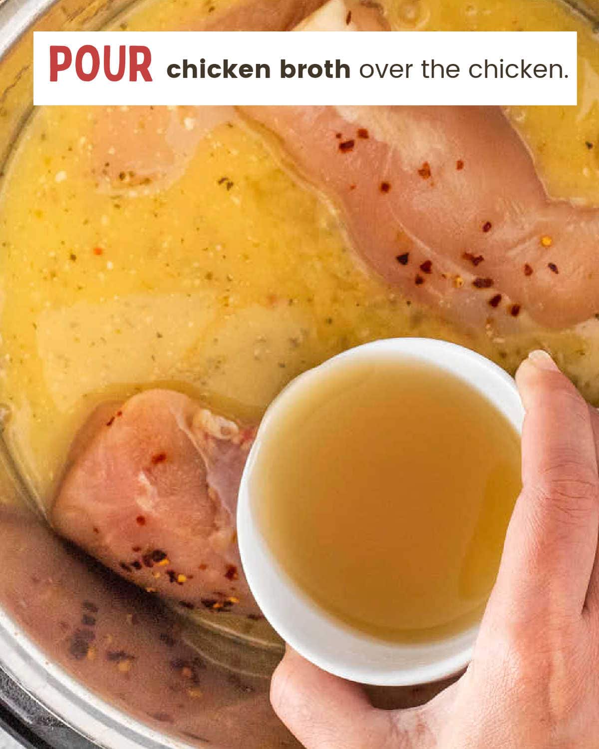 Adding chicken broth to the pot of chicken and Italian dressing.